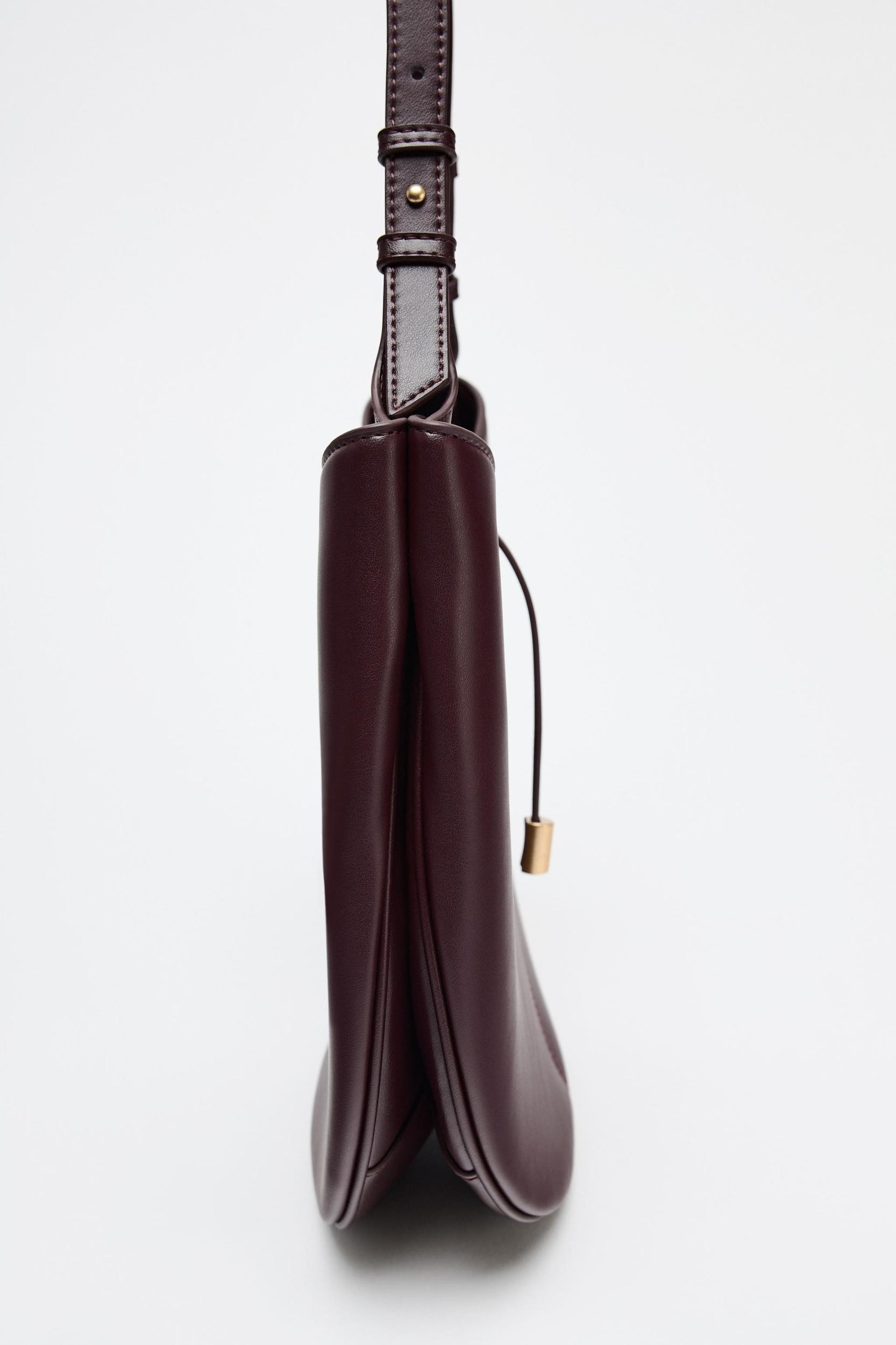 BUCKET BAG WITH PENDANT DETAIL Product Image