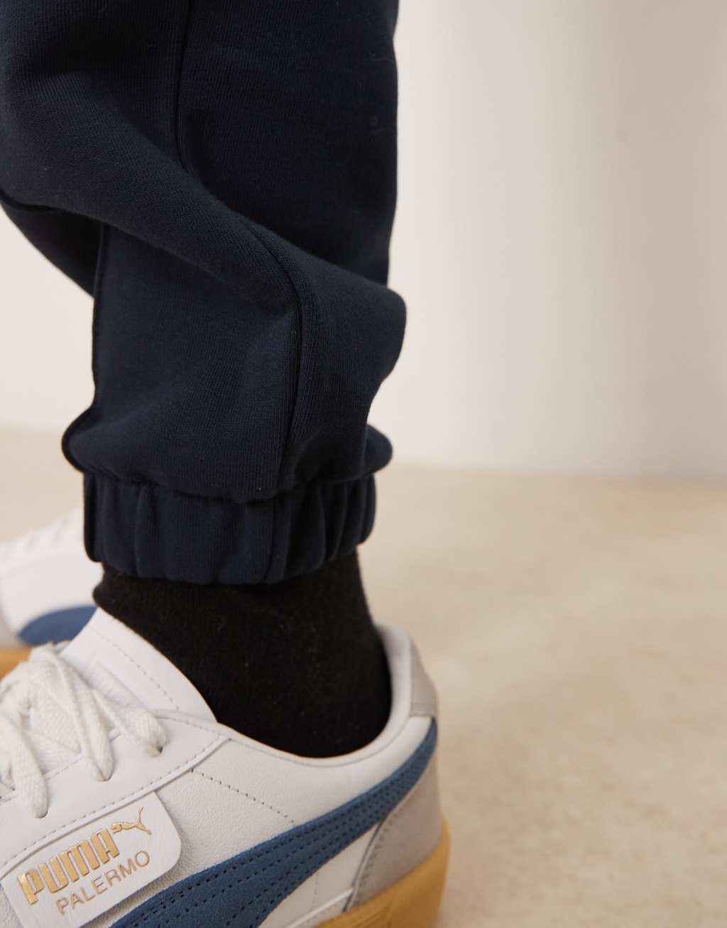 ASOS DESIGN tapered pin tuck sweatpants in navy - part of a set Product Image