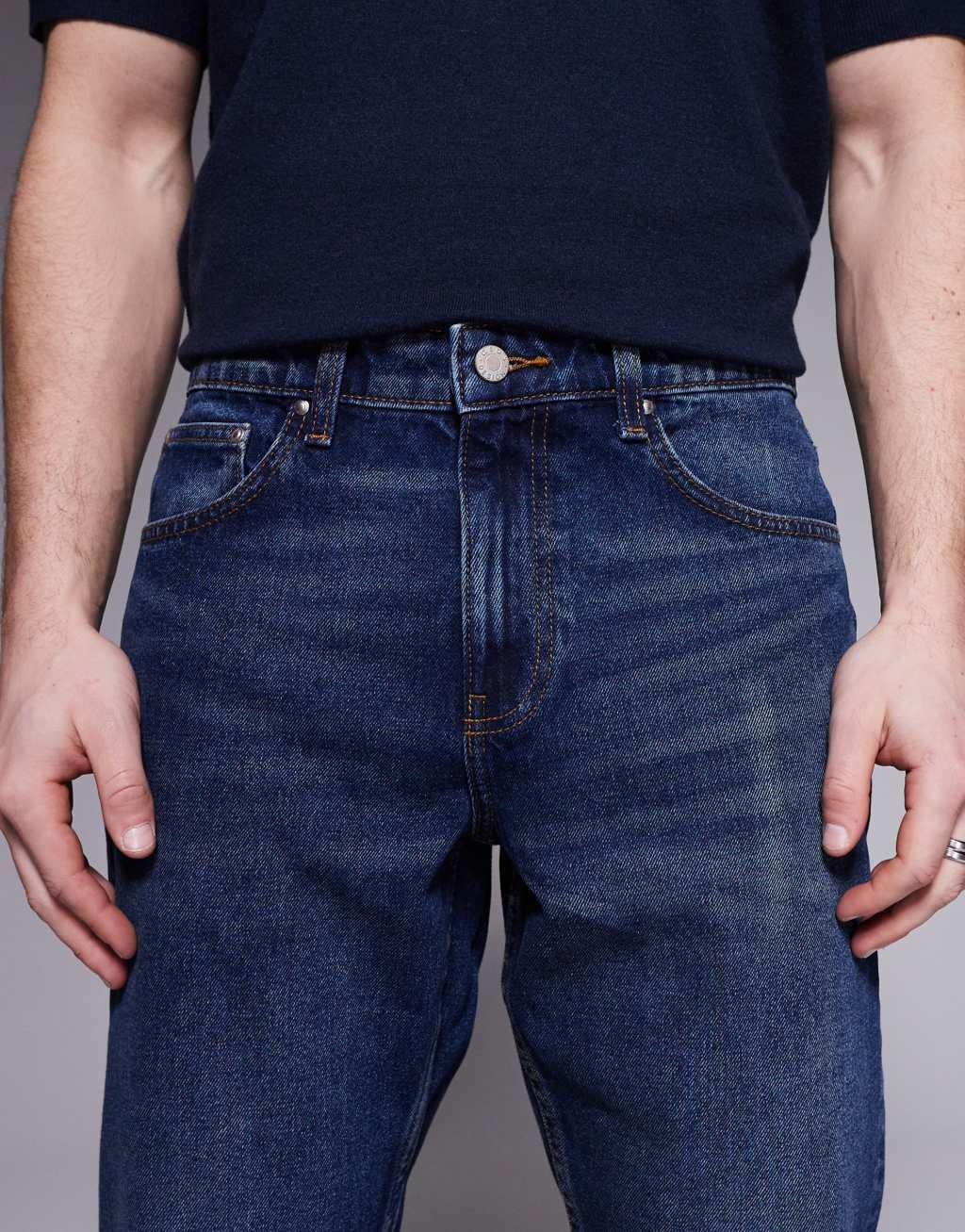 ASOS DESIGN tapered jeans in vintage dark wash blue Product Image