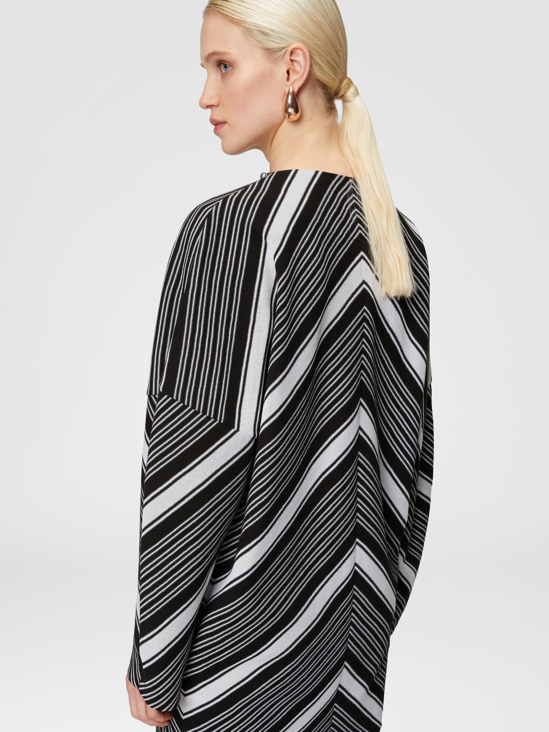 Mini-dress with oversized sleeves and plunging V-neckline Product Image