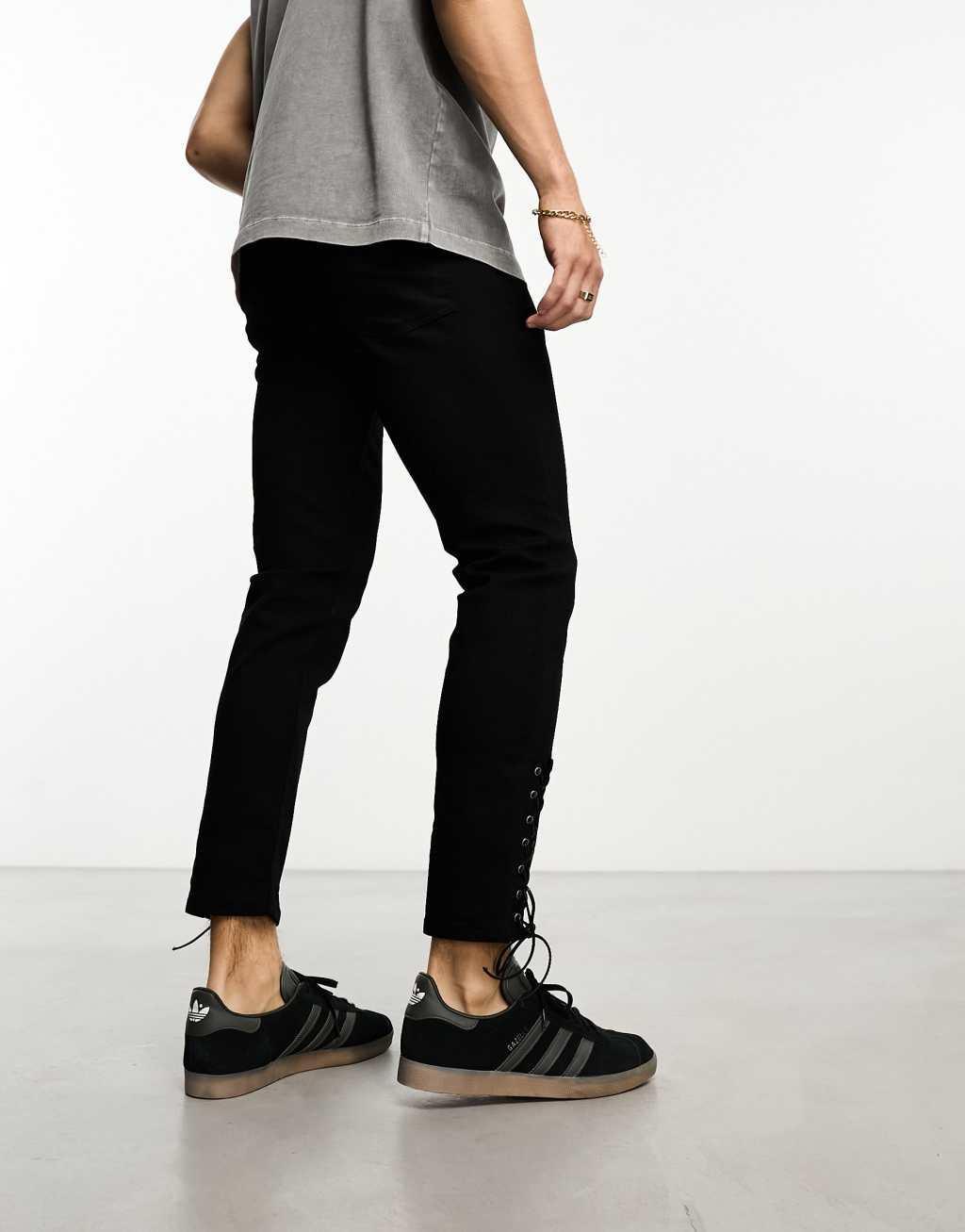 ASOS DESIGN skinny jeans with hem ties in black Product Image