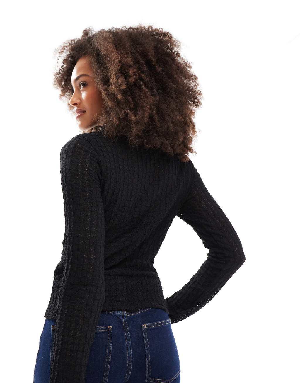 Vero Moda Aware textured long sleeved high neck top in black Product Image