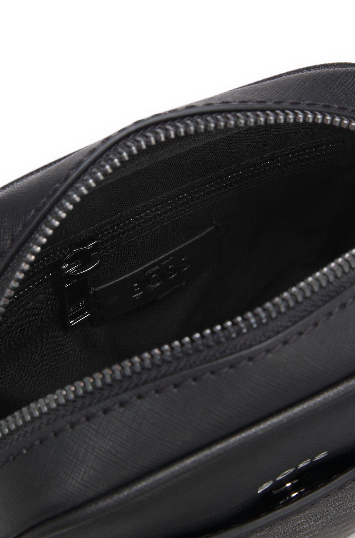Reporter bag with monogram-patterned front pocket Product Image