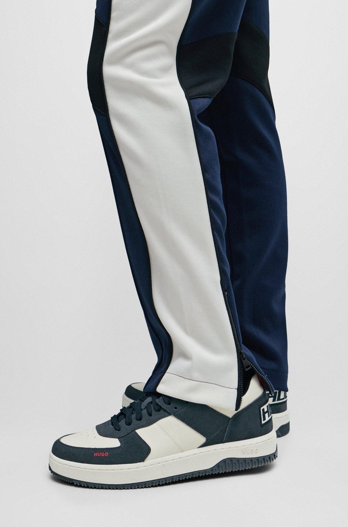 Relaxed-fit tracksuit bottoms with color-blocking Product Image