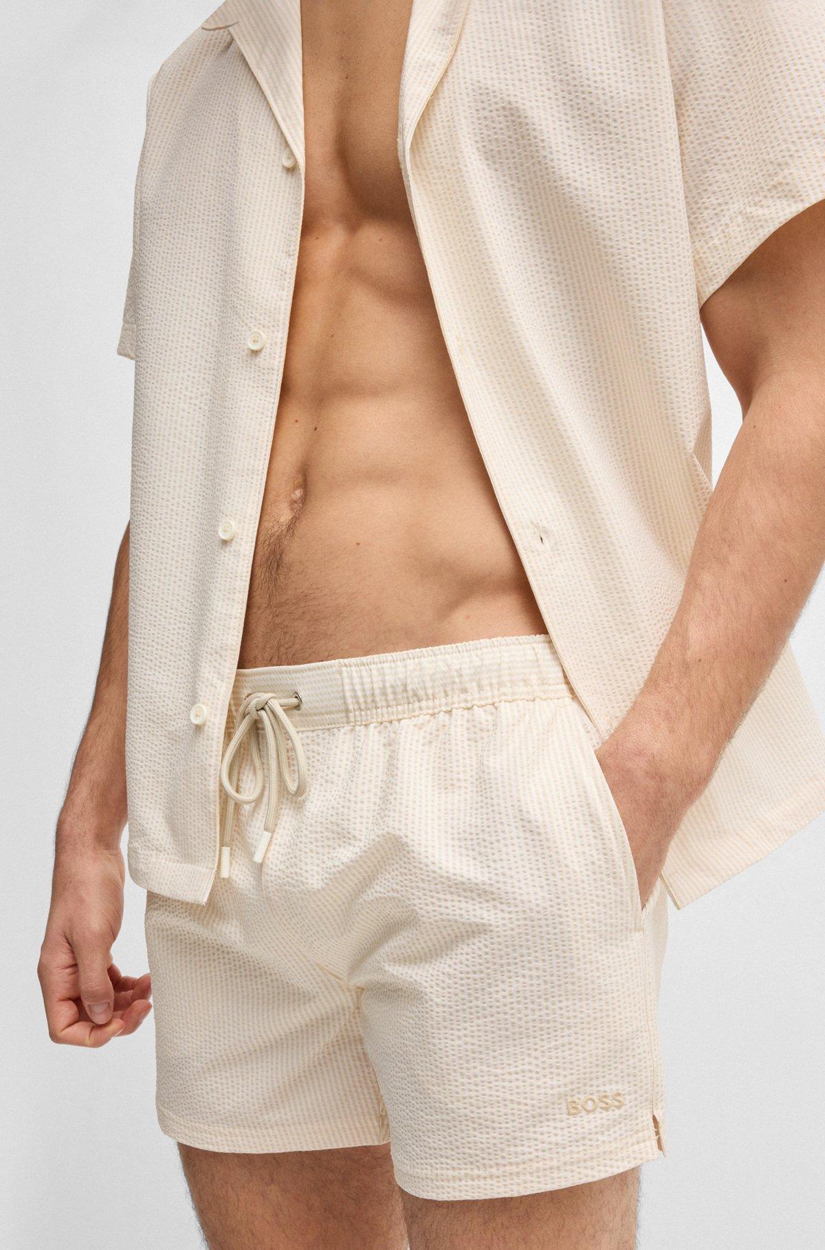Swim shorts in striped seersucker fabric Product Image