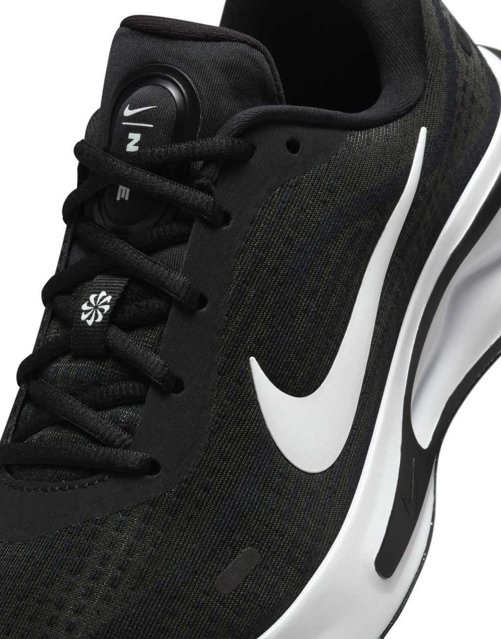 Nike Running Journey Run sneakers in black and white Product Image