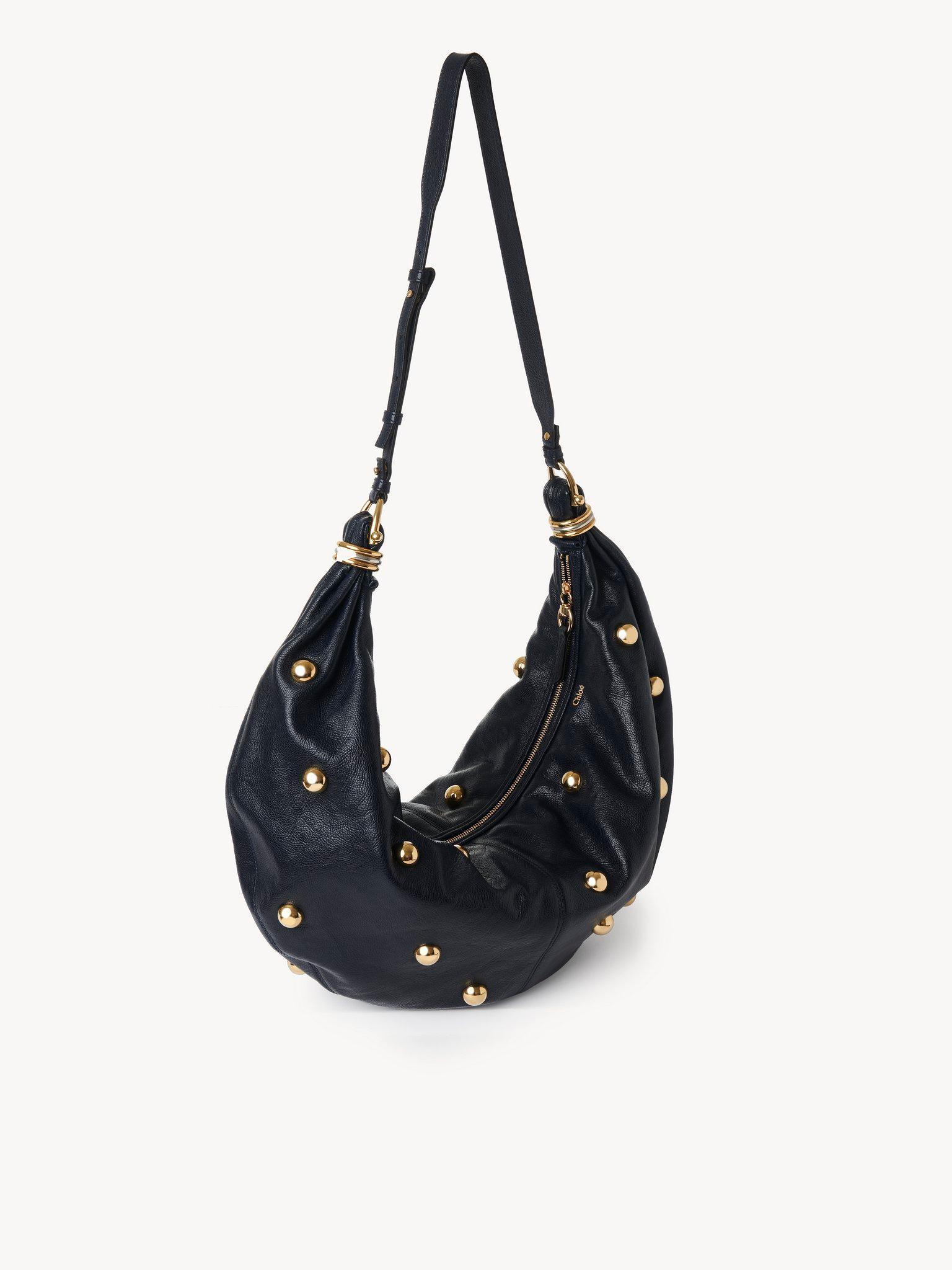 Large Bracelet hobo bag in grained leather with studs Product Image