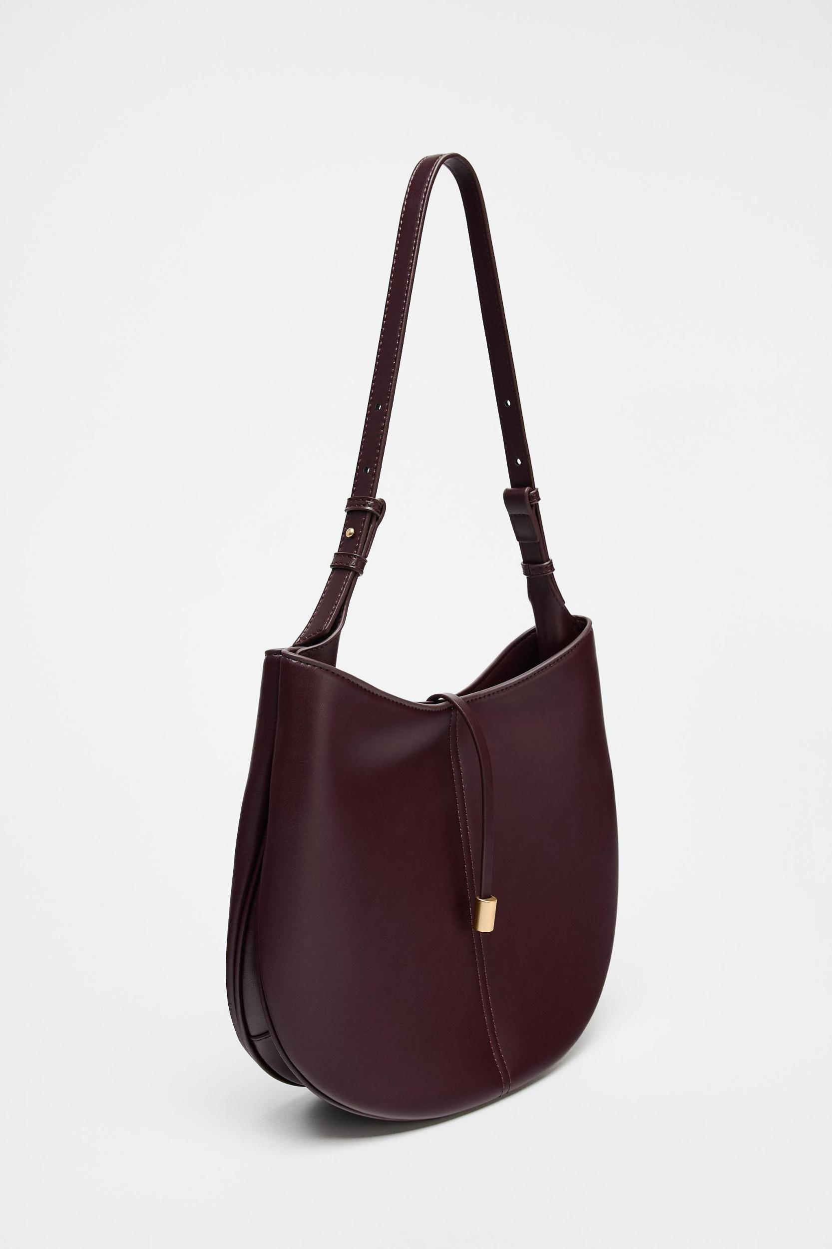 BUCKET BAG WITH PENDANT DETAIL Product Image