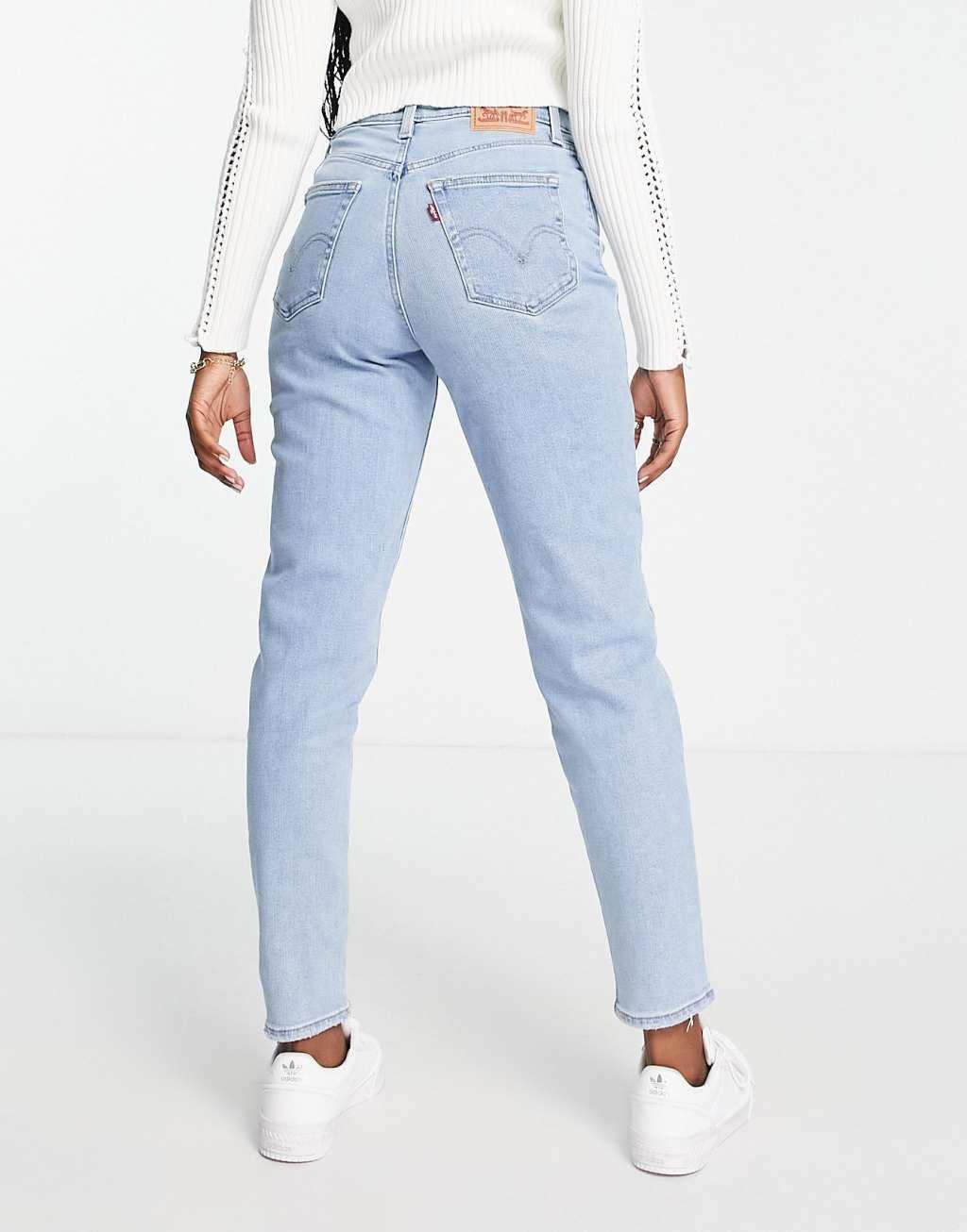 Levi's high waisted distressed mom jean in light wash blue Product Image