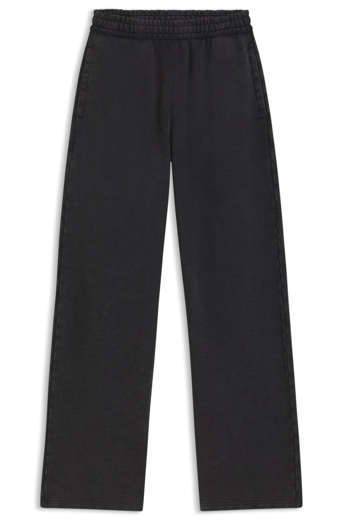 HUGO - Loose-fit tracksuit bottoms in cotton terry - Black Product Image