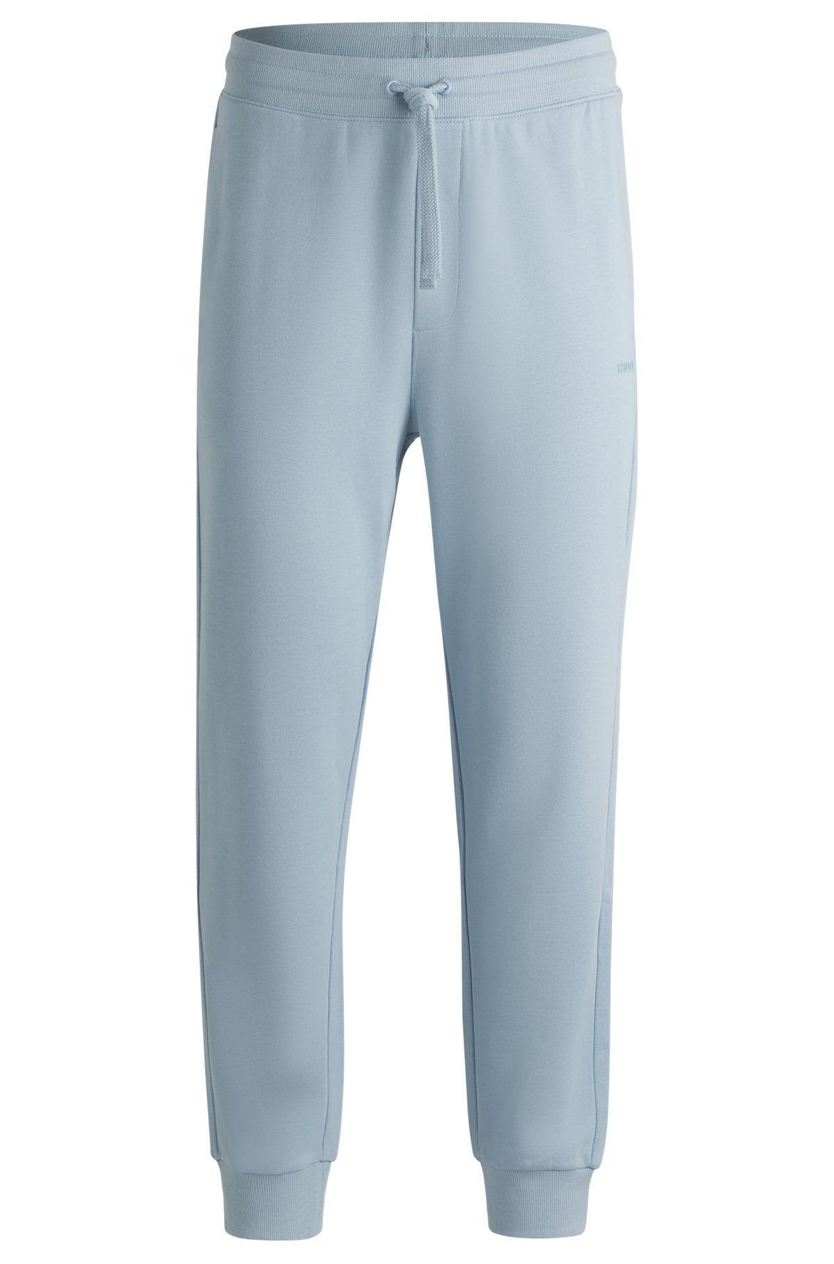 Cotton-terry tracksuit bottoms with logo print Product Image