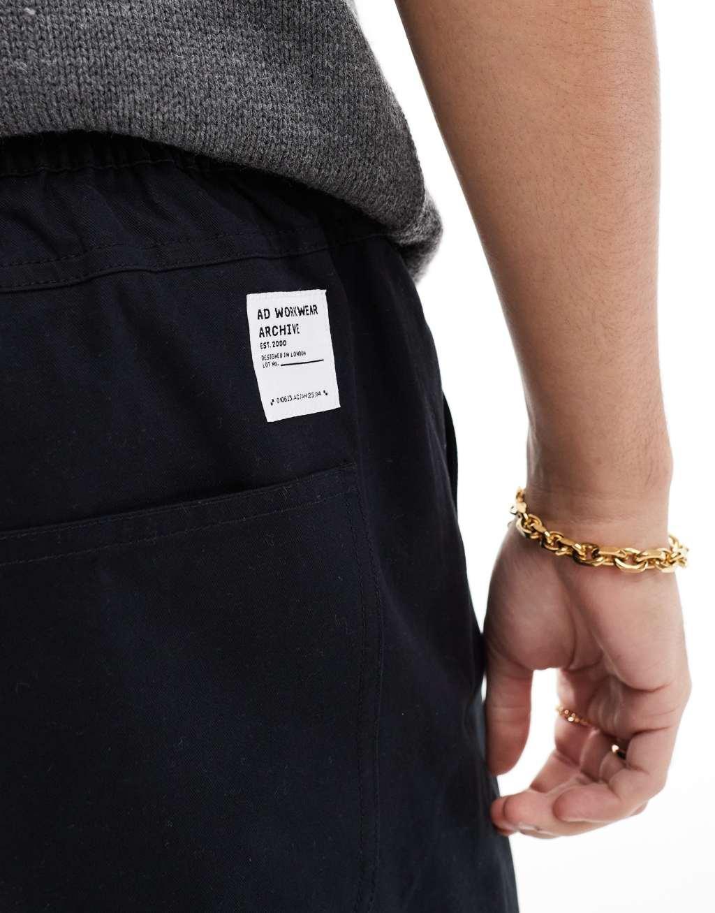 ASOS DESIGN tapered pull on pants in black with patch Product Image