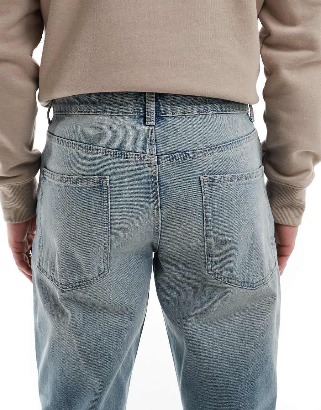 ASOS DESIGN tapered jeans in light wash blue  Product Image