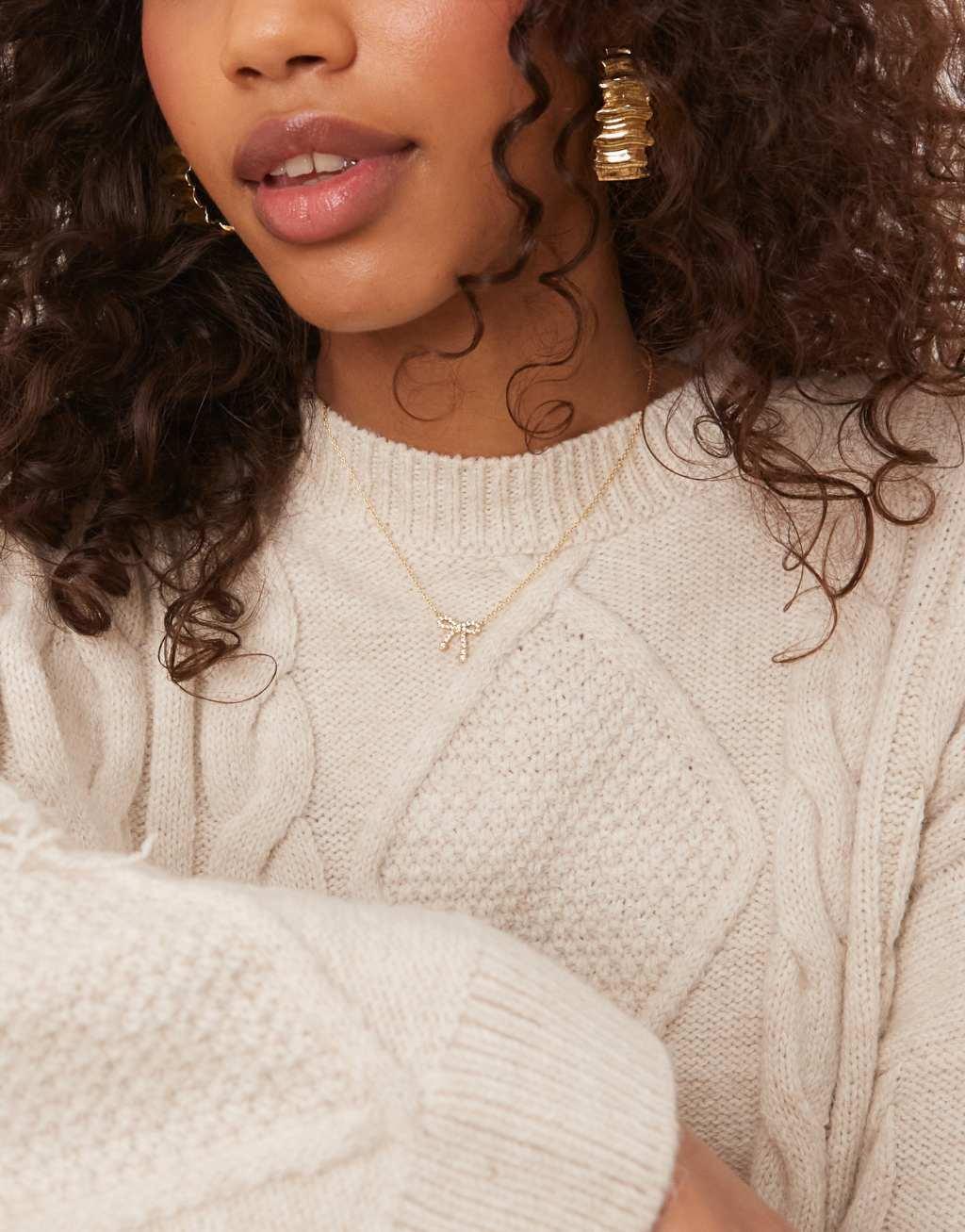 ASOS DESIGN premium oversized cable knit sweater with fringing in ecru Product Image