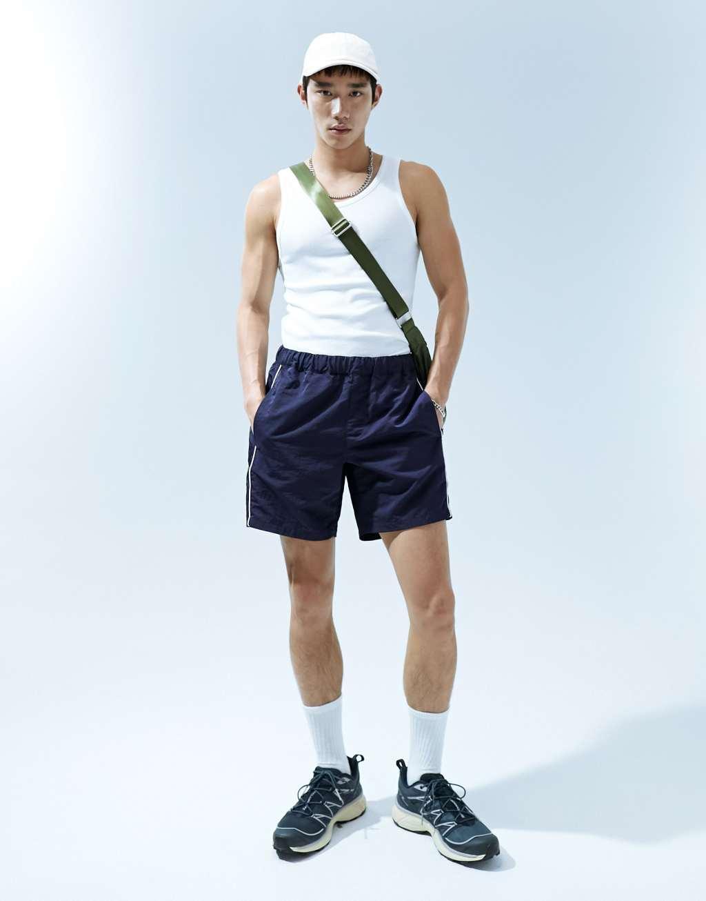 ASOS DESIGN slim nylon shorts with piping detail Product Image