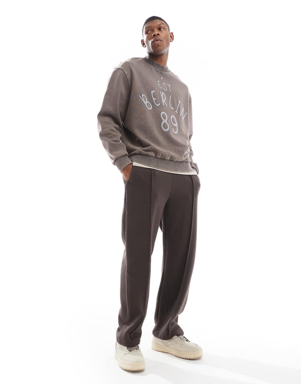ASOS DESIGN oversized sweatshirt in acid wash with applique print in charcoal Product Image
