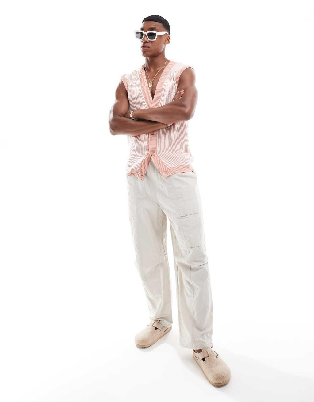 ASOS DESIGN oversized button up sleeveless cardigan in light pink pleated rib knit Product Image