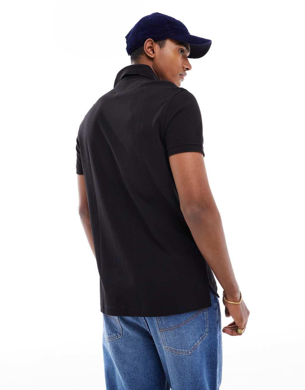 Tommy Hilfiger 1985 icon logo regular fit pique polo shirt in black Product Image