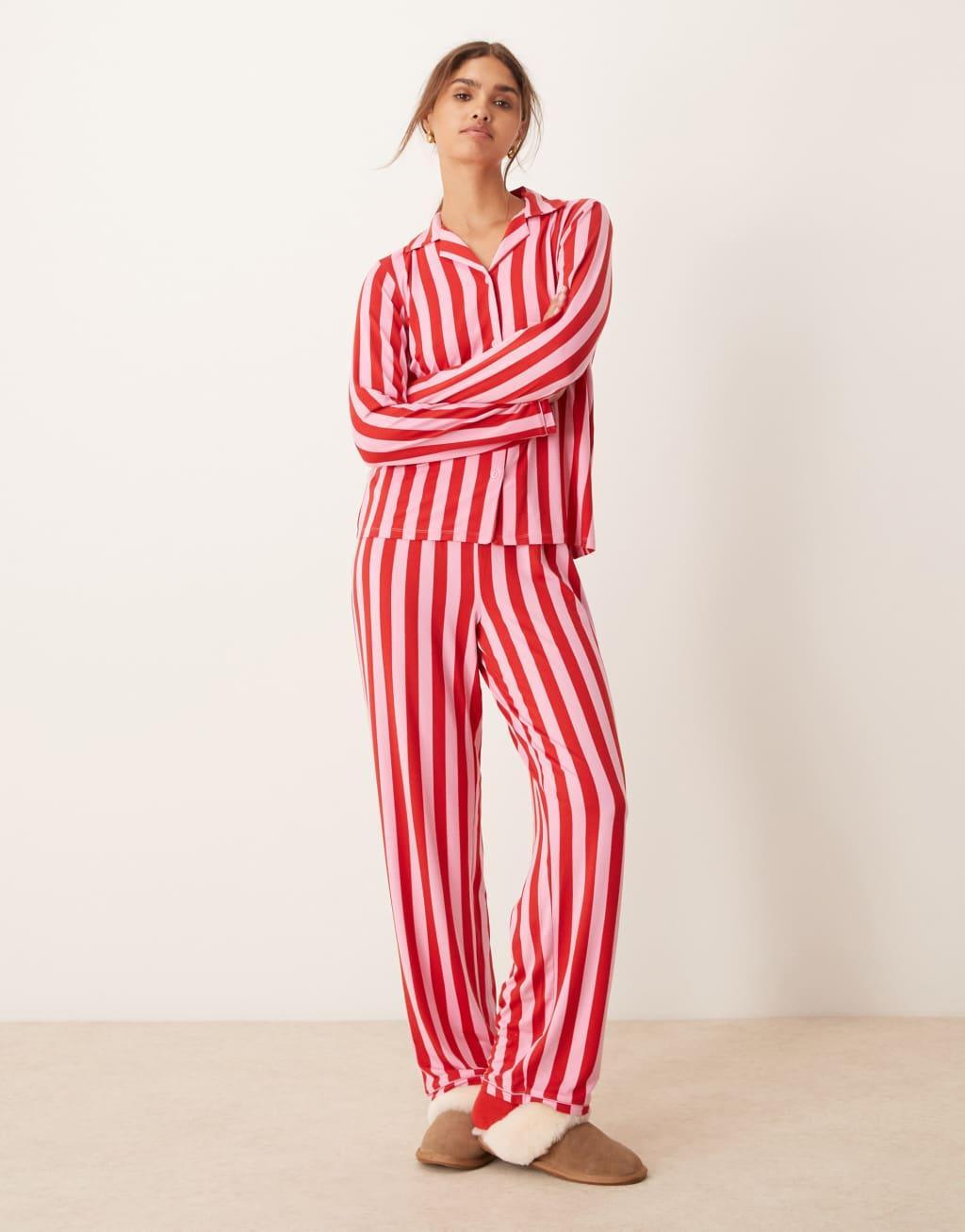 Urban Threads Christmas poly long sleeve revere and pants pajama set in pink and red stripe print Product Image