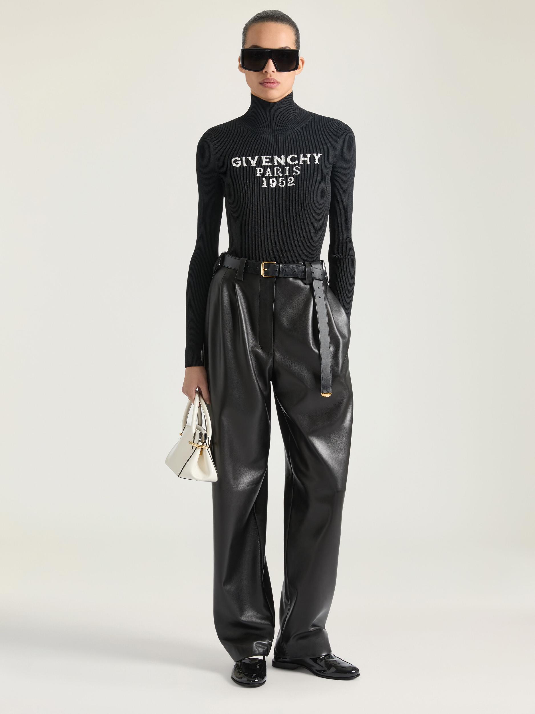 Double-breasted sleeveless jacket in leather Product Image