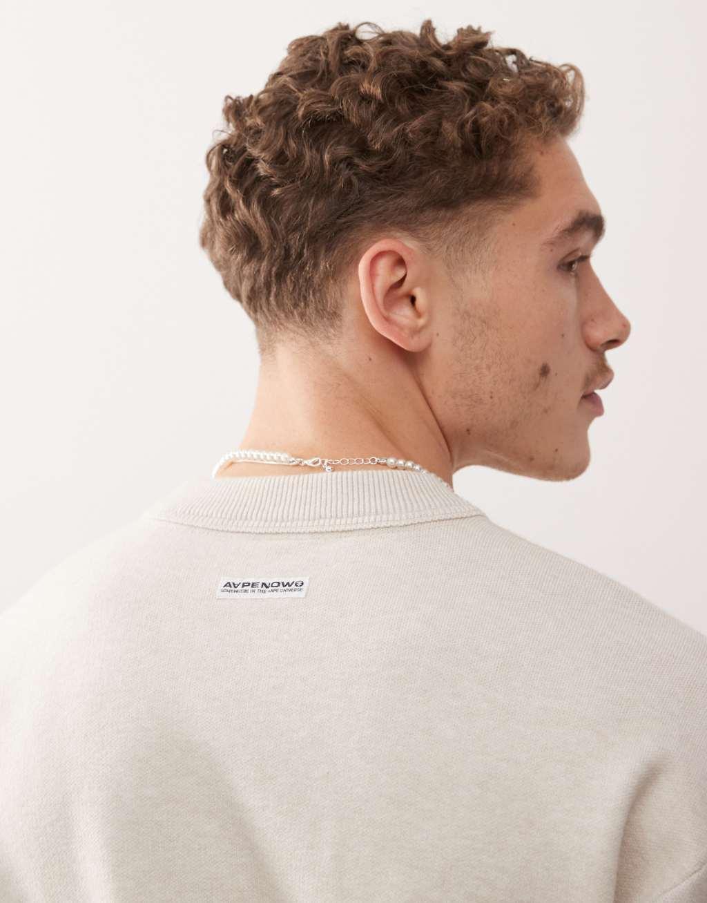 Aape By A Bathing Ape Now knitted sweater in beige  Product Image