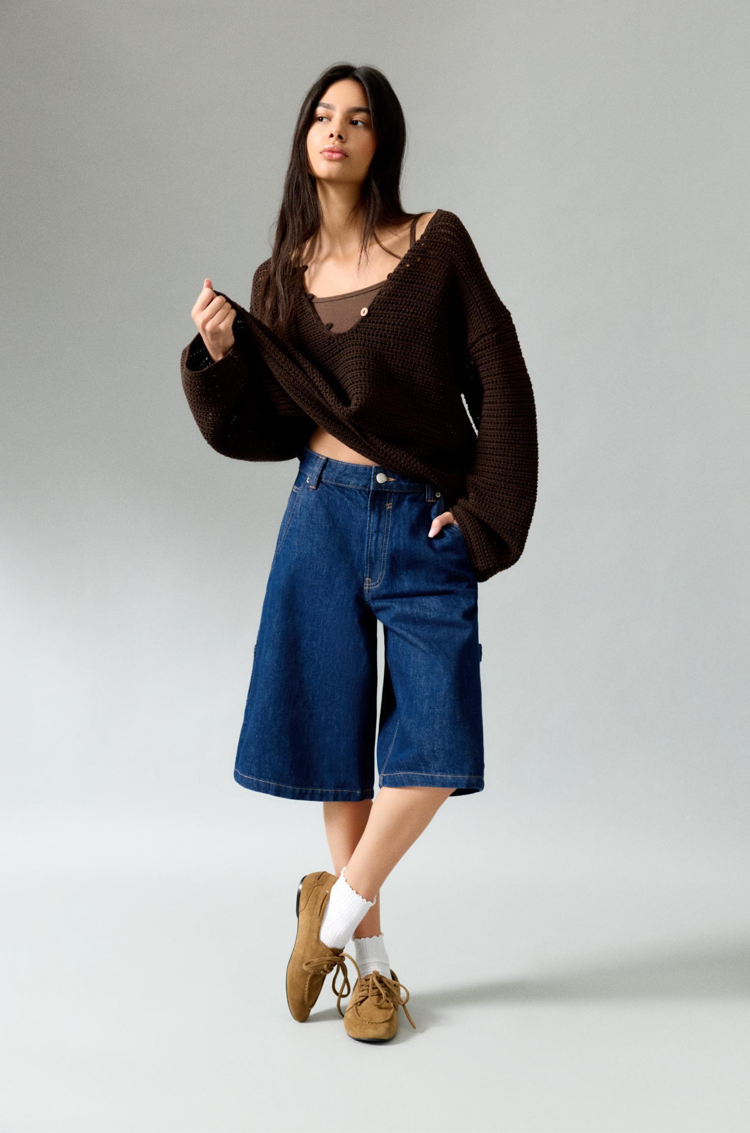 Open knit sweater with buttons Product Image