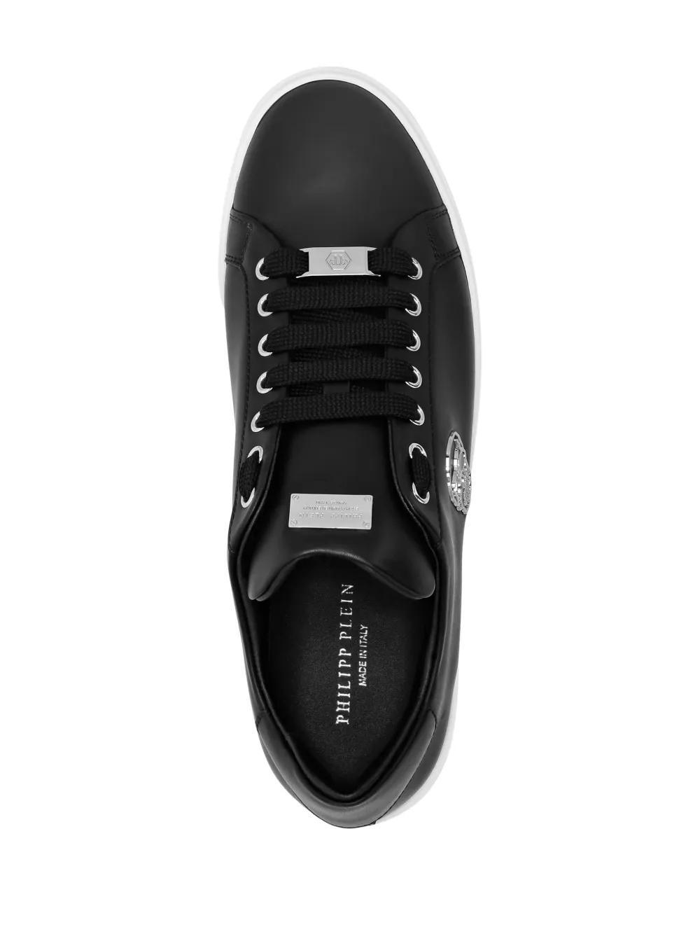 Skull-appliqué leather sneakers Product Image