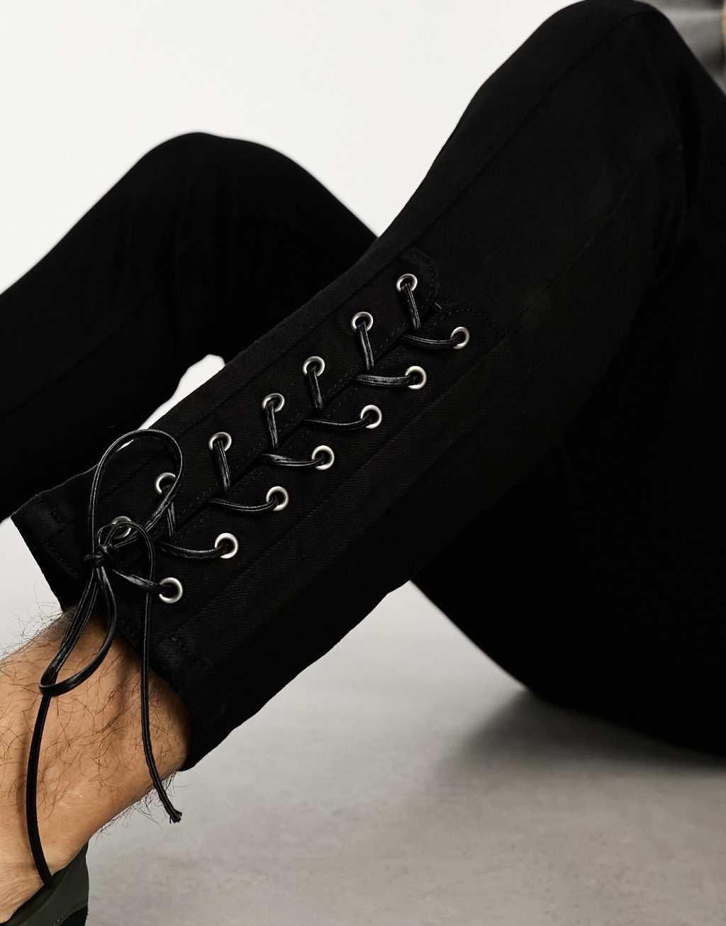 ASOS DESIGN skinny jeans with hem ties in black Product Image
