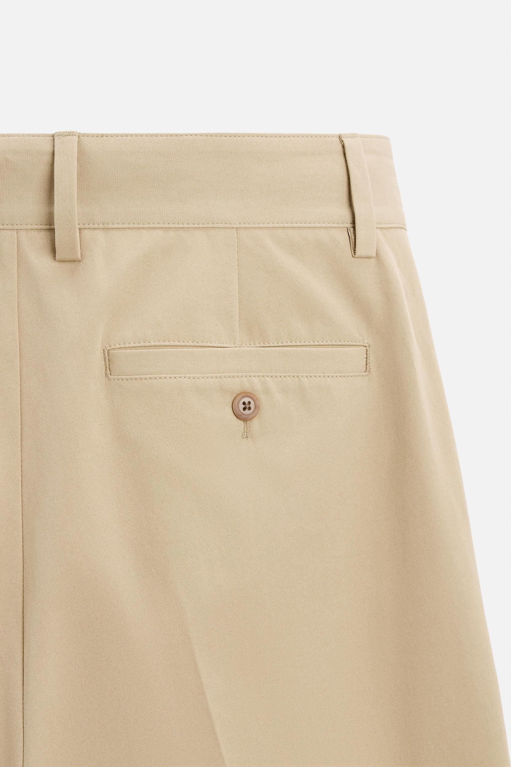 PLEATED STRAIGHT FIT PANTS Product Image