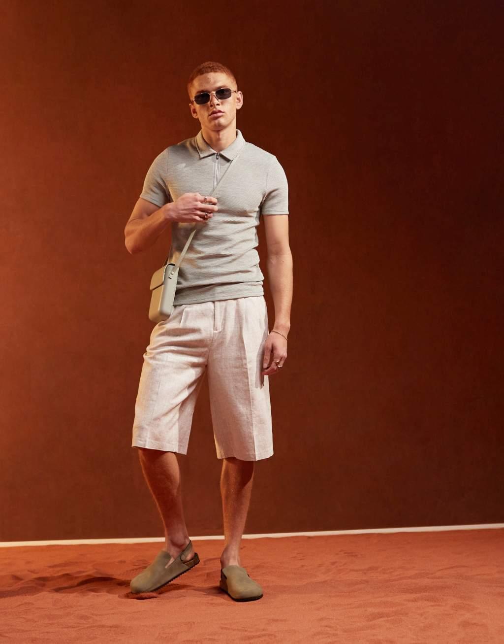 ASOS DESIGN muscle fit polo shirt with zip neck in textured beige Product Image