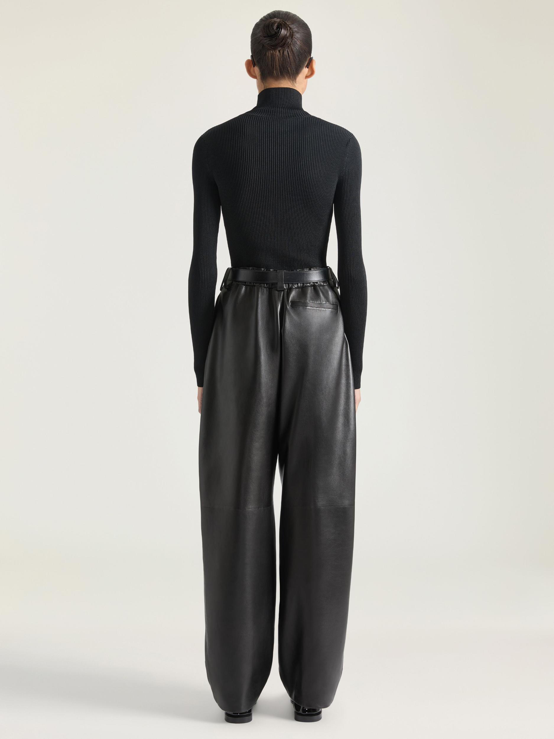 Double-breasted sleeveless jacket in leather Product Image