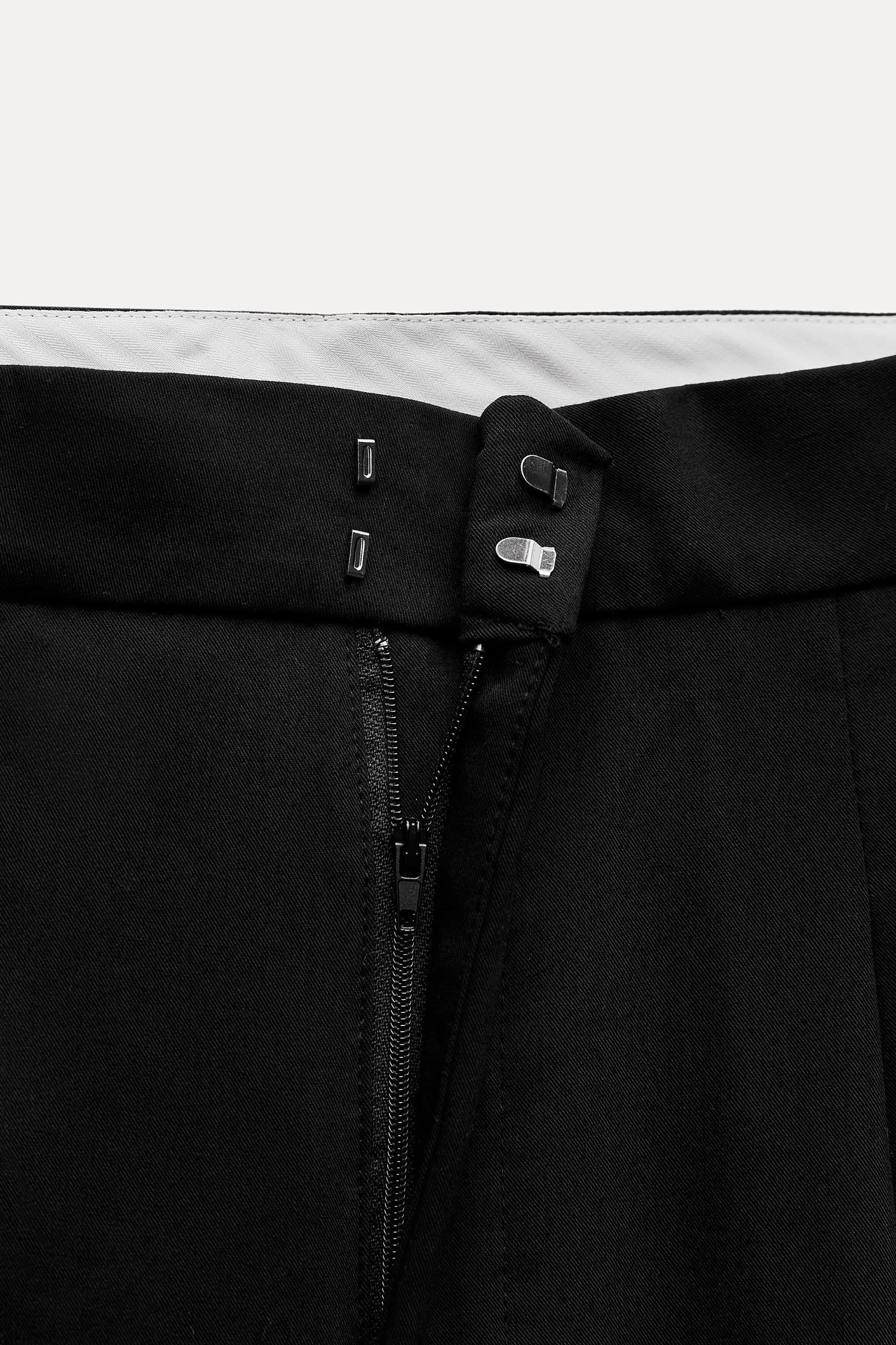 PLEATED PANTS WITH POCKETS Product Image