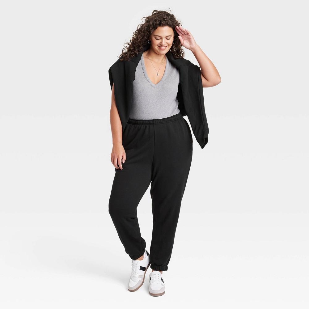 Women's Leisure Studio Mid-Rise Fleece Essential Joggers - Universal Thread™ Black 4X: Cotton Fleece, Elastic Waistband Product Image