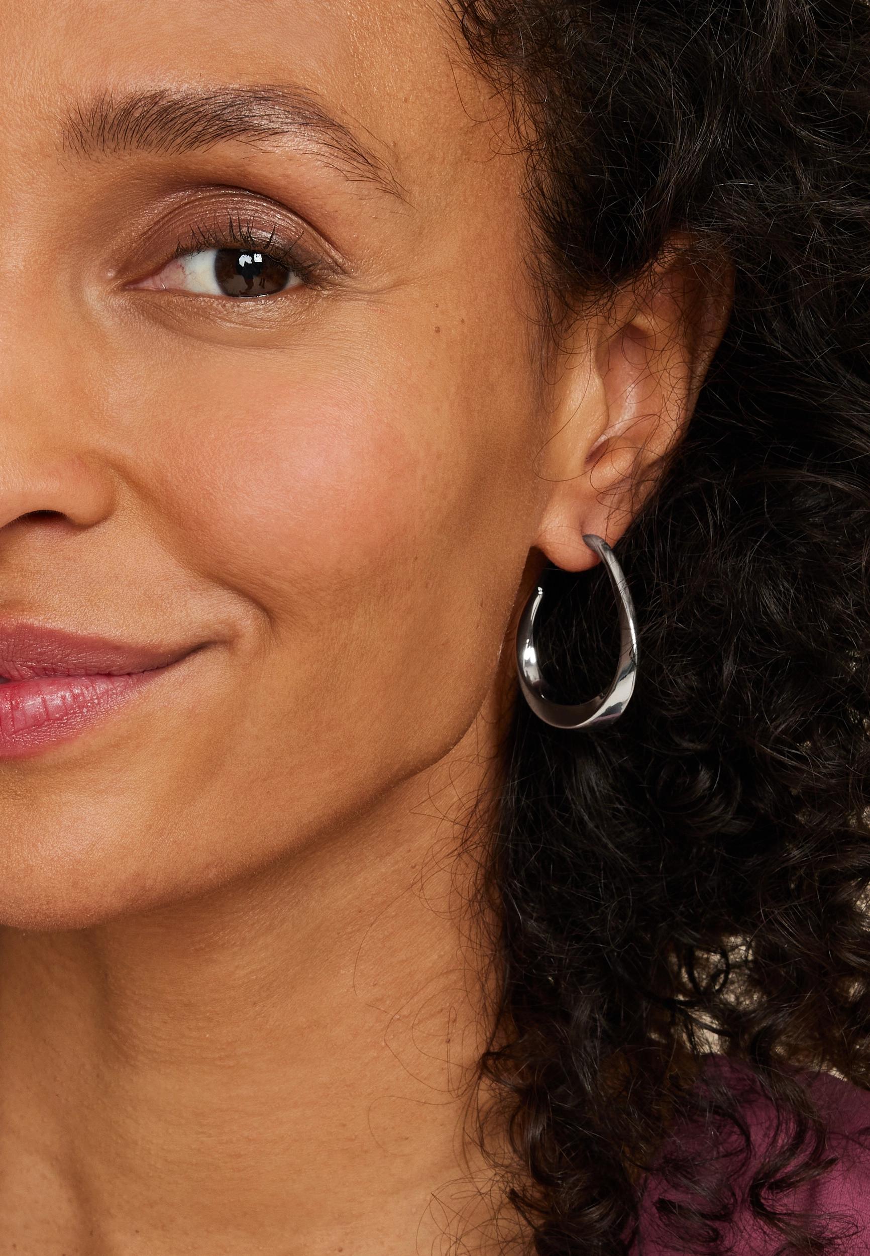 Maurices Womens Silver Twist Oval Hoop Earrings Product Image