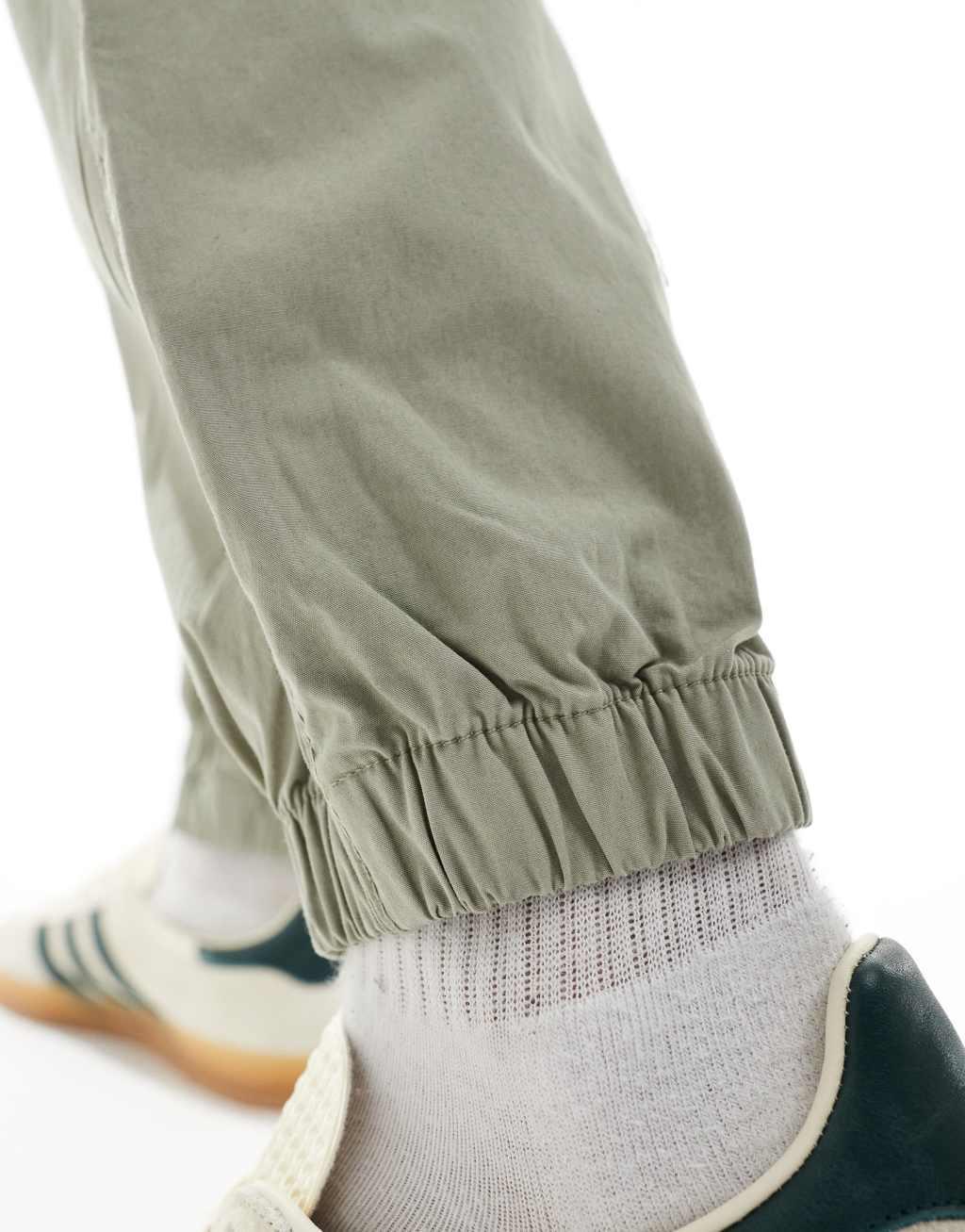 ASOS DESIGN tapered pull on pants in sage green Product Image