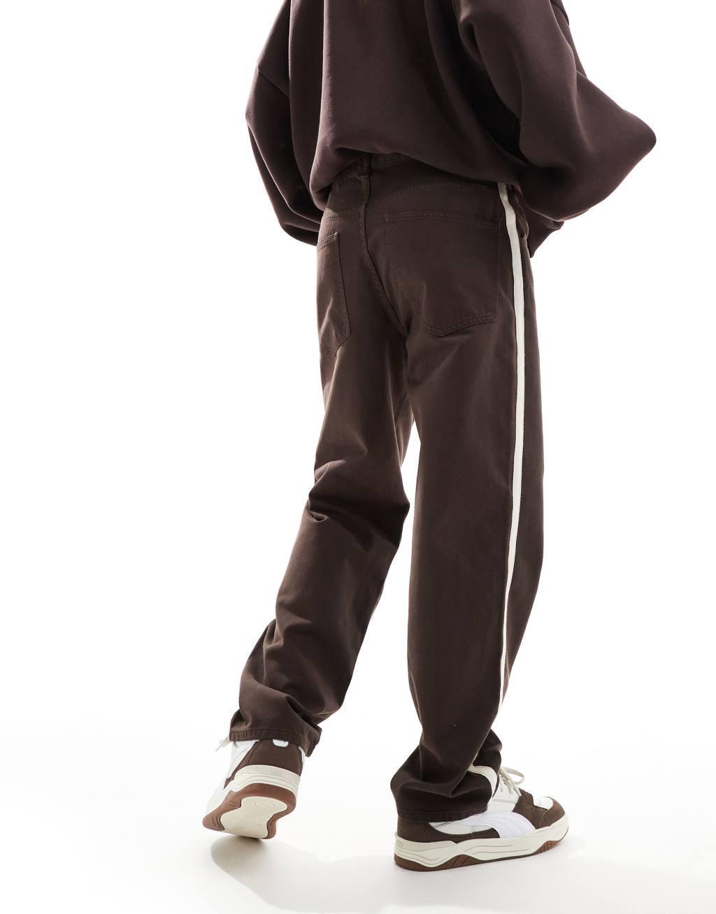 ASOS DESIGN baggy tapered pants with taped detail in brown Product Image