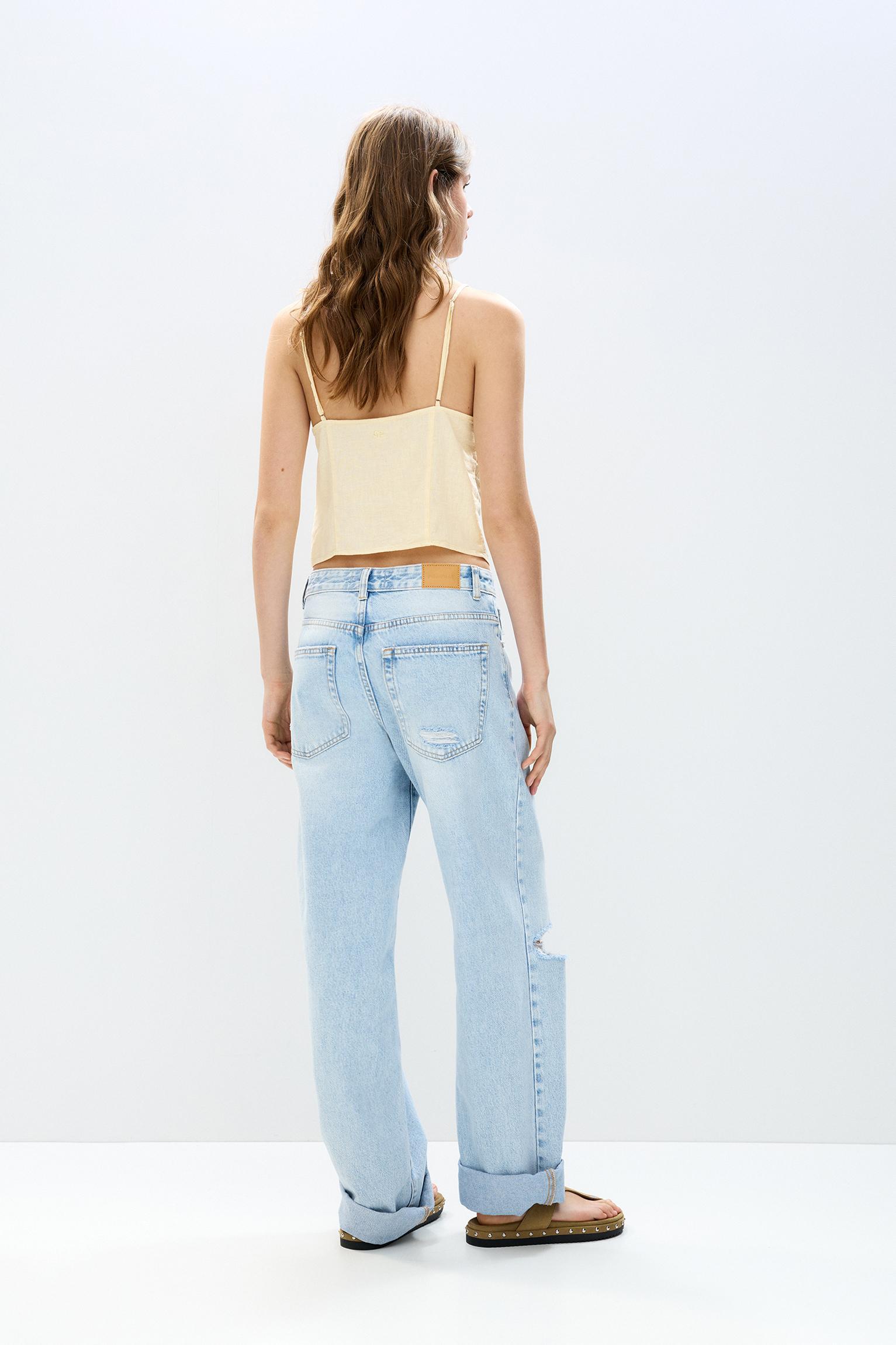 Lace-trimmed top with straps Product Image