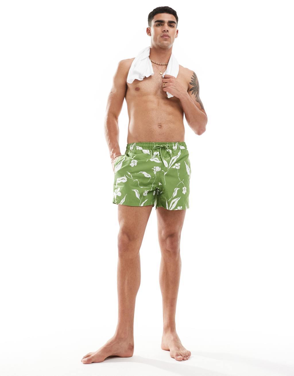 ASOS DESIGN swim shorts in short length in green floral print Product Image