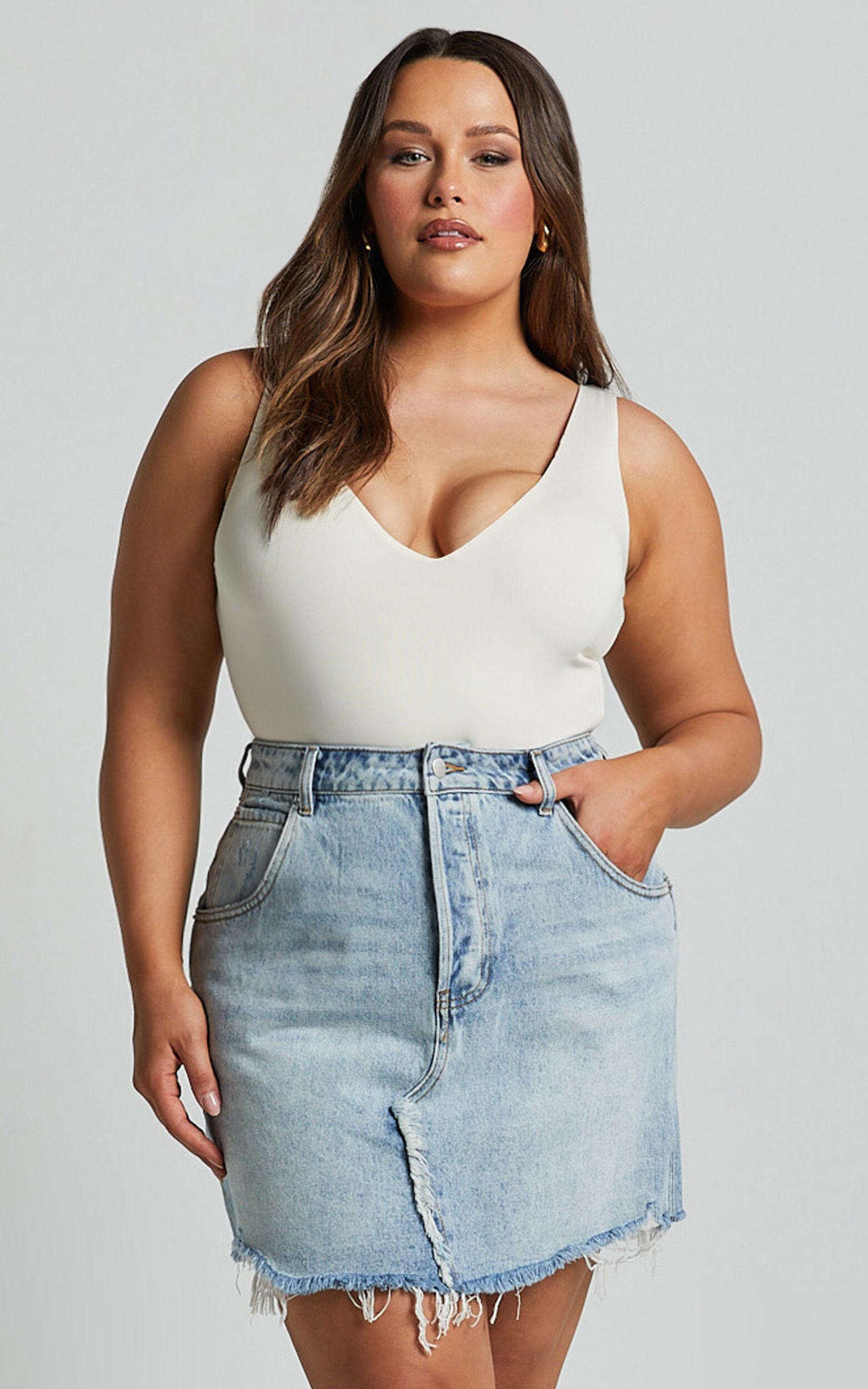 Pieta Mini Skirt - Recycled Cotton Raw Hem Denim Skirt in Mid Blue Wash Product Image