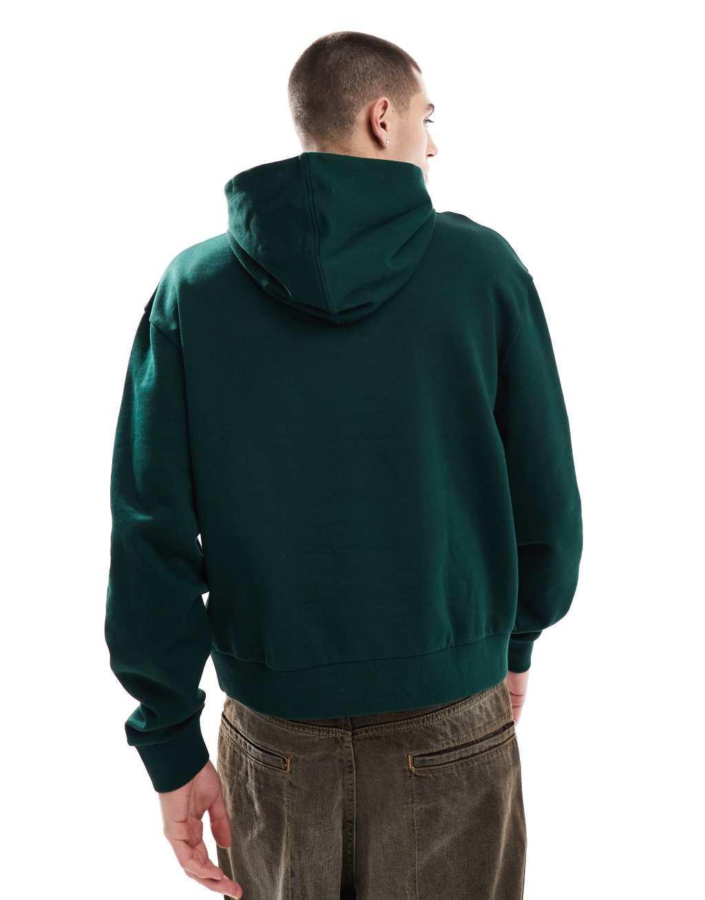 ASOS DESIGN oversized boxy hoodie with belmont print in green Product Image