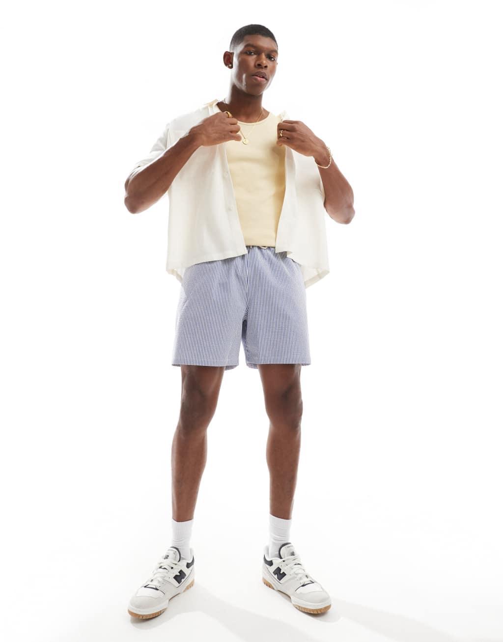 Polo Ralph Lauren Traveler icon logo seersucker stripe swim shorts in blue Product Image