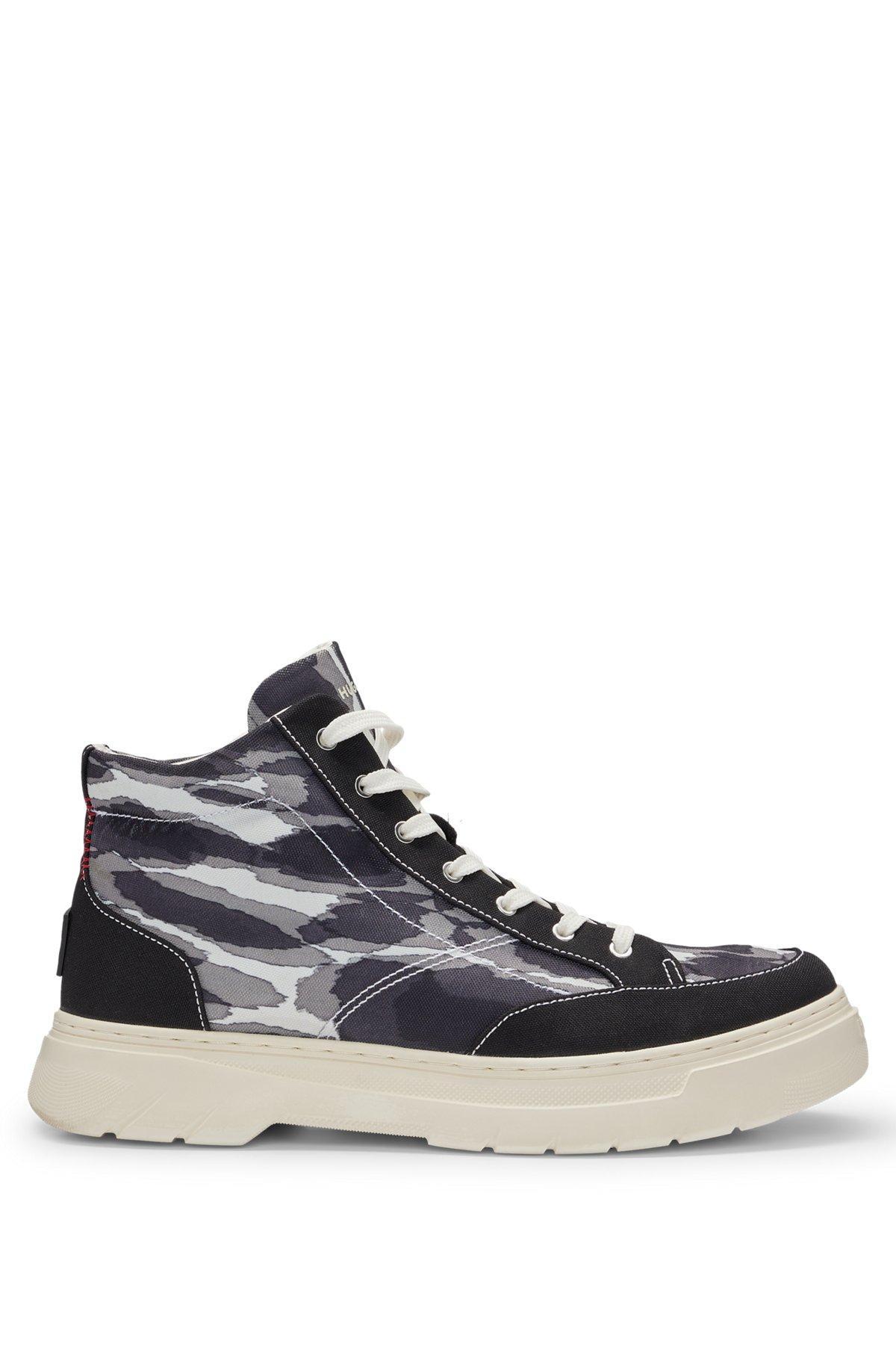 Camouflage-print high-top trainers with stacked logo Product Image