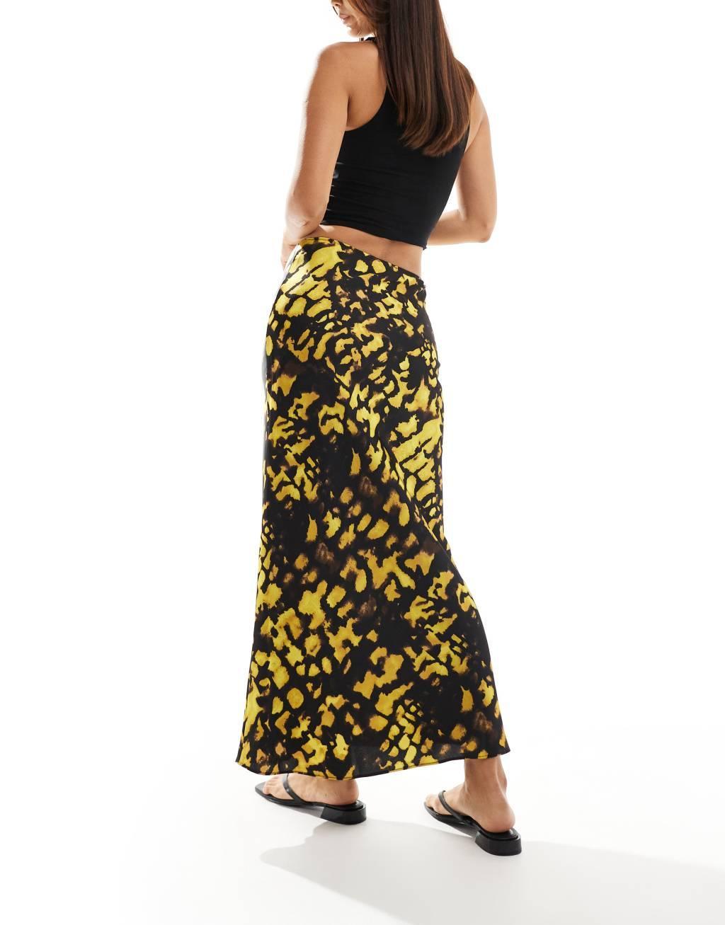 ASOS DESIGN satin bias cut midi skirt in yellow and black splotch print Product Image