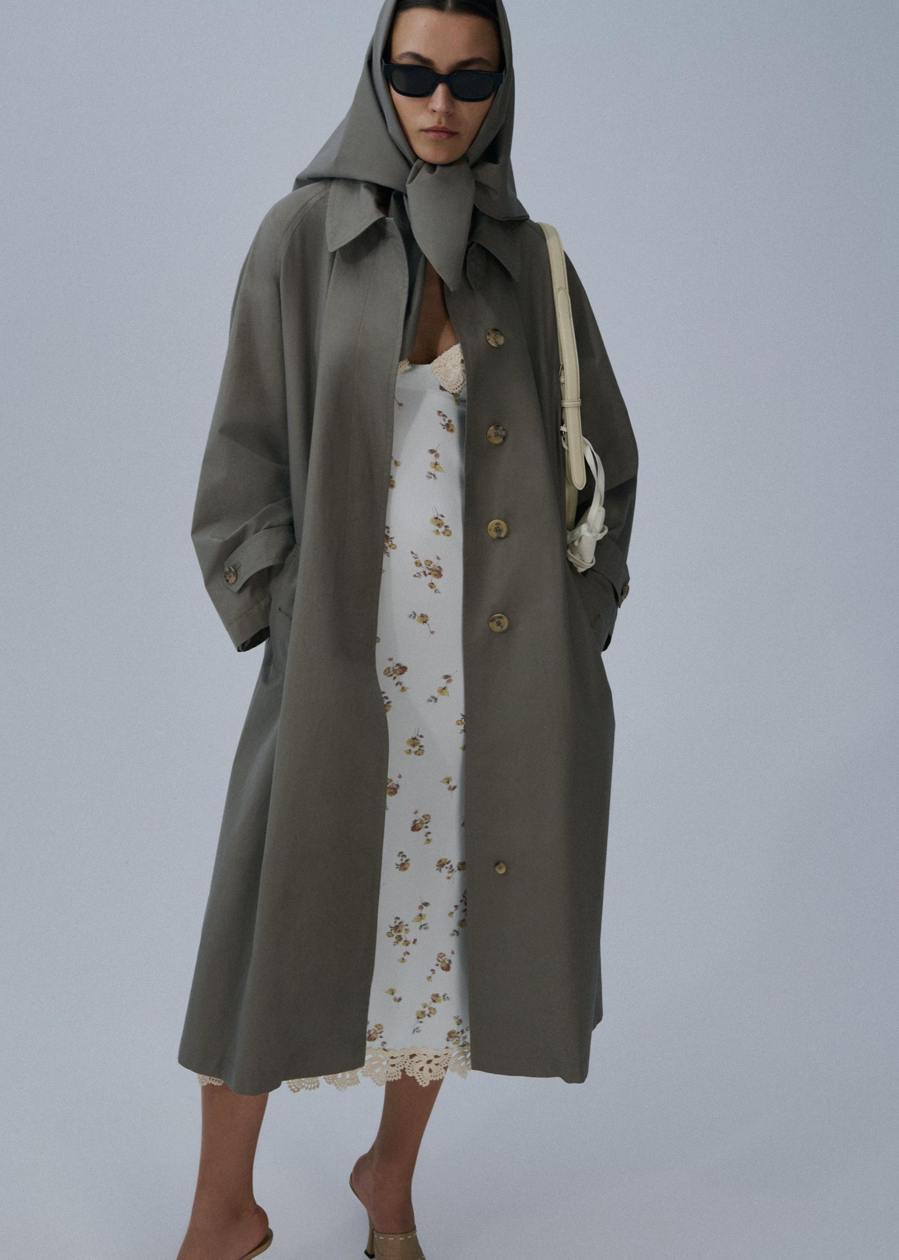Belted cotton trench coat in grey Product Image