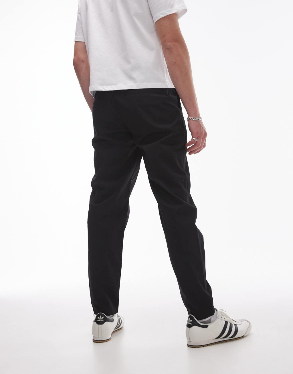 Topman twin pleated tapered pants in black Product Image