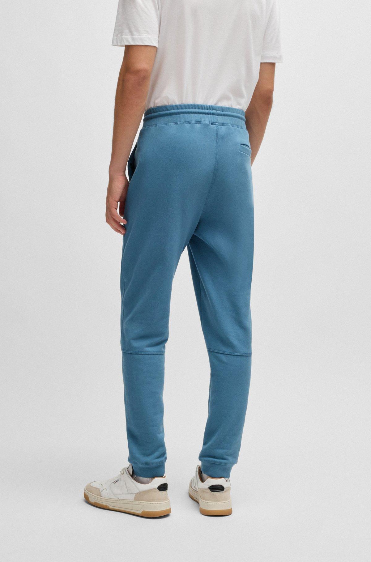 Cotton-terry tracksuit bottoms with logo patch Product Image