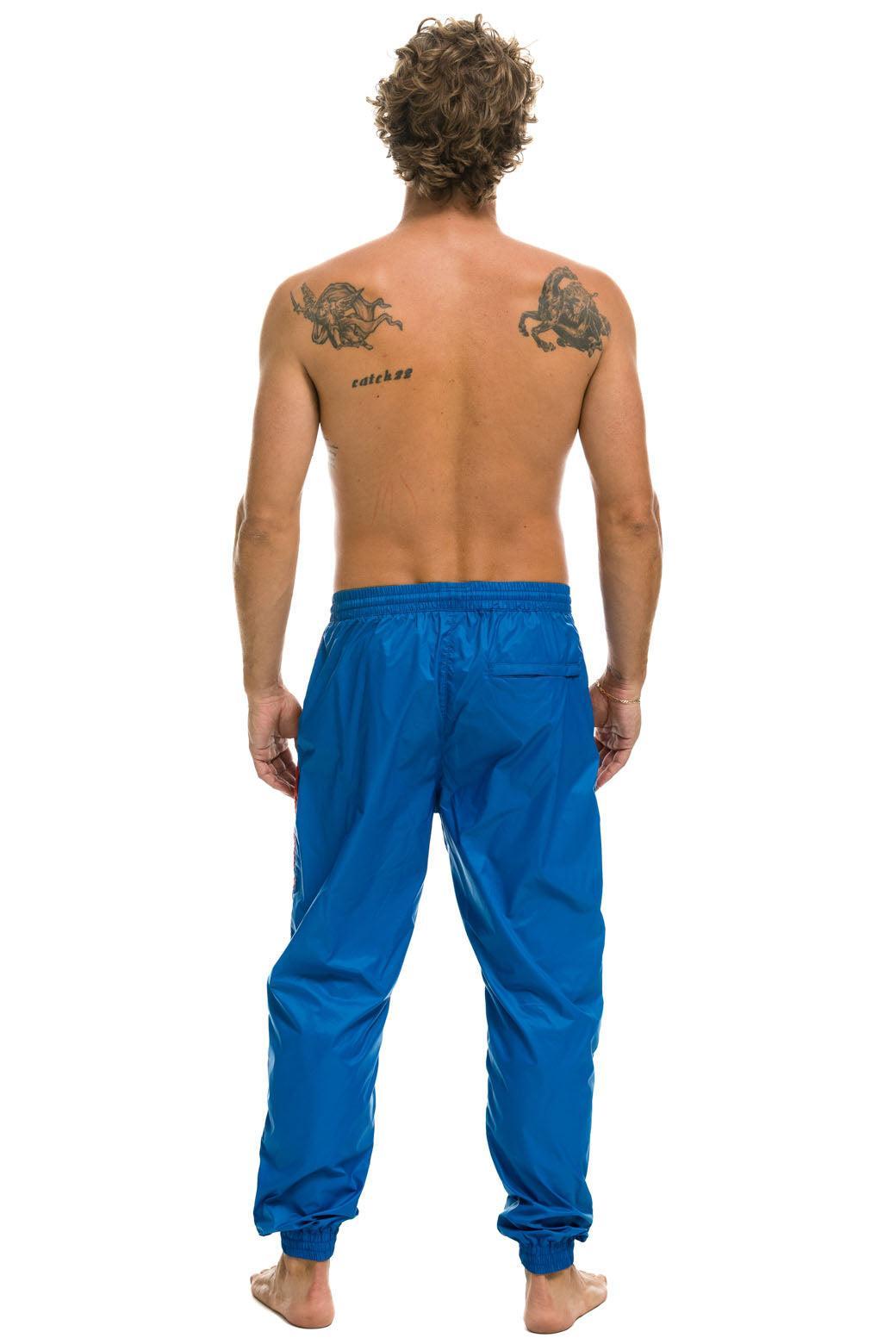 MEN'S 4 STRIPE WIND PANT - SNORKEL BLUE Male Product Image