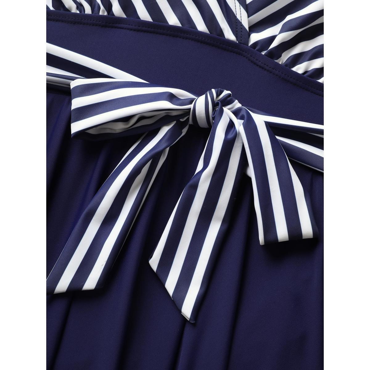 Plus Size Striped Patchwork Wrap Tie Knot Swim Dress Women's Swimwear Indigo Beach Bodycon Overlap Collar High stretch Curve Swim Dresses BloomChic 12/L Product Image