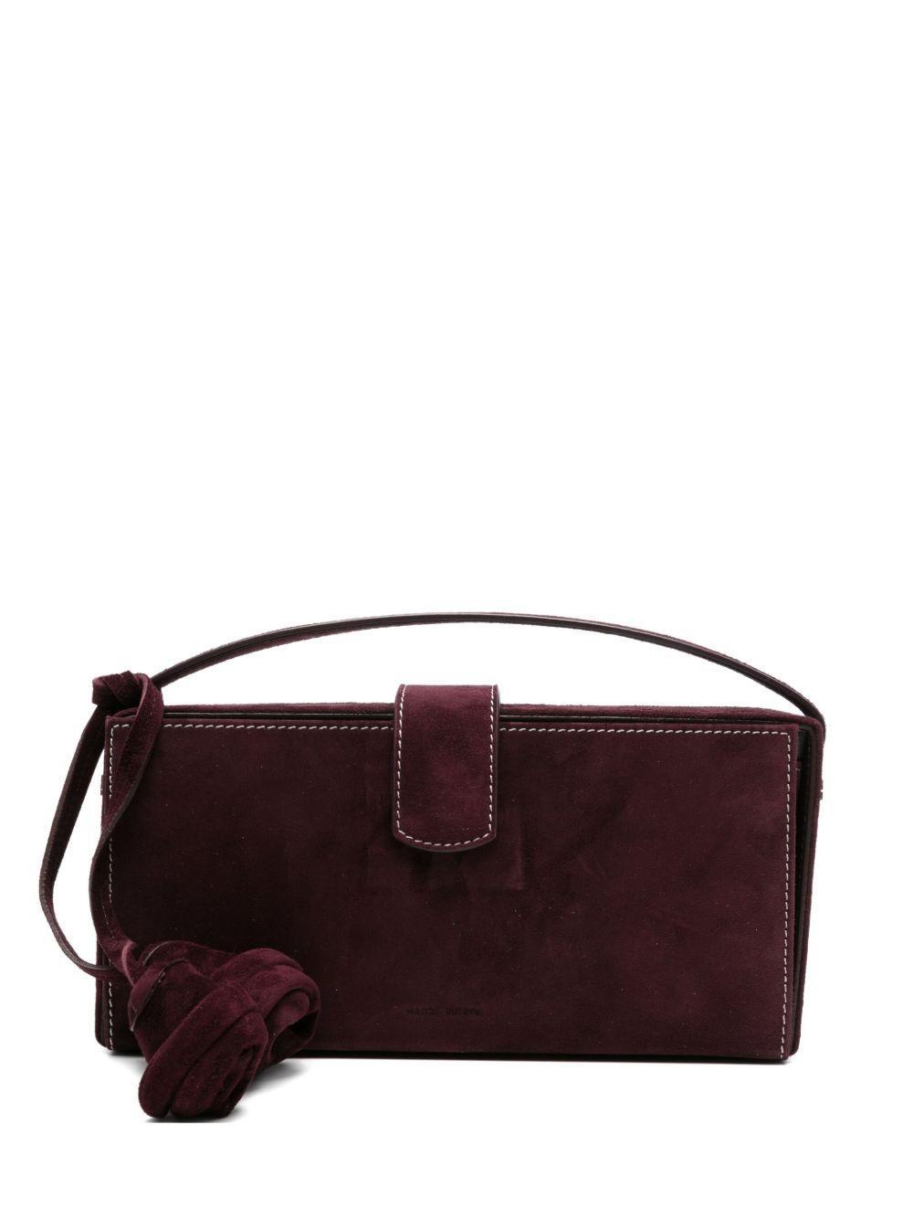Apolonia rose-embellished suede clutch bag Product Image