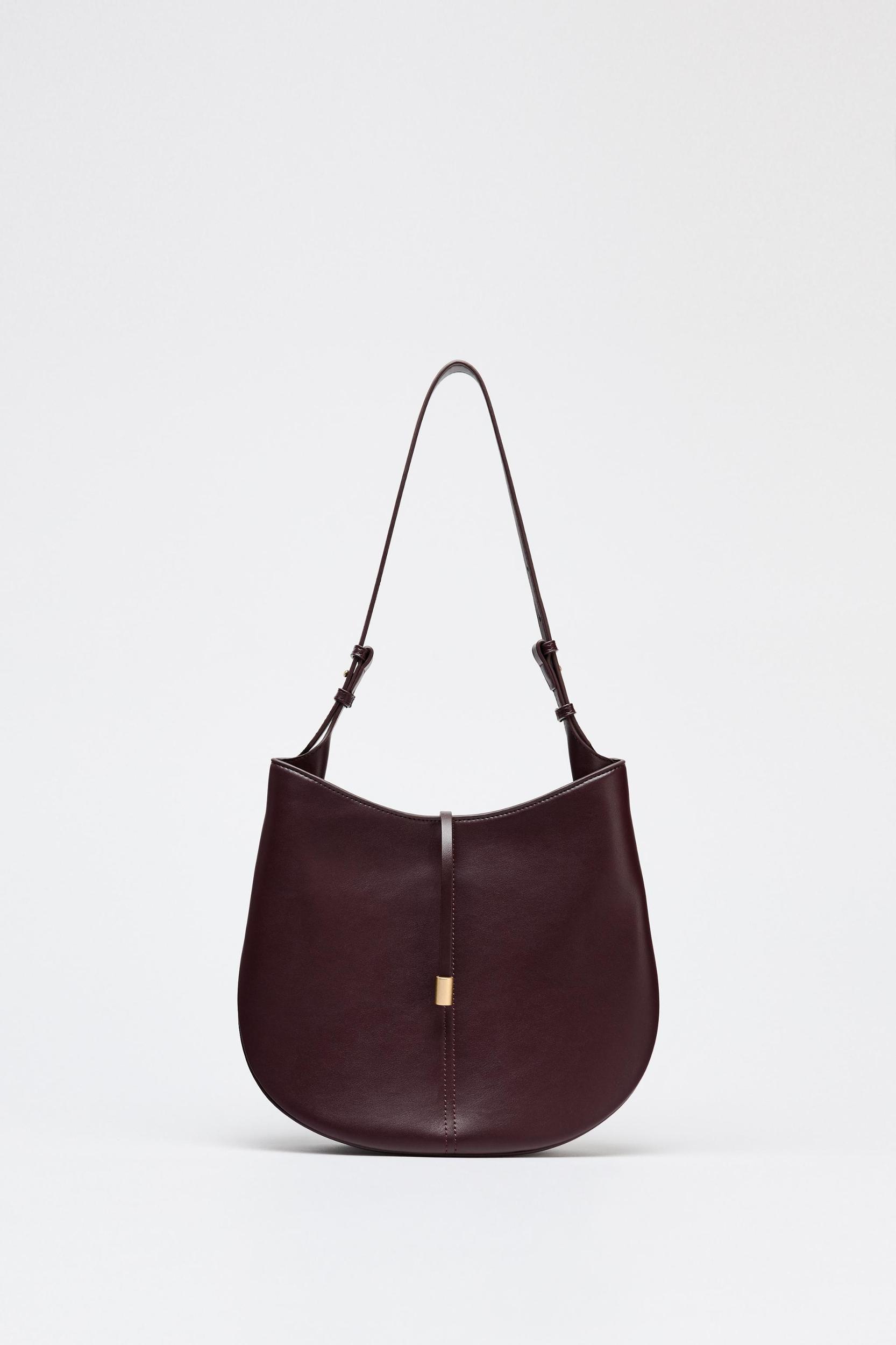 BUCKET BAG WITH PENDANT DETAIL Product Image